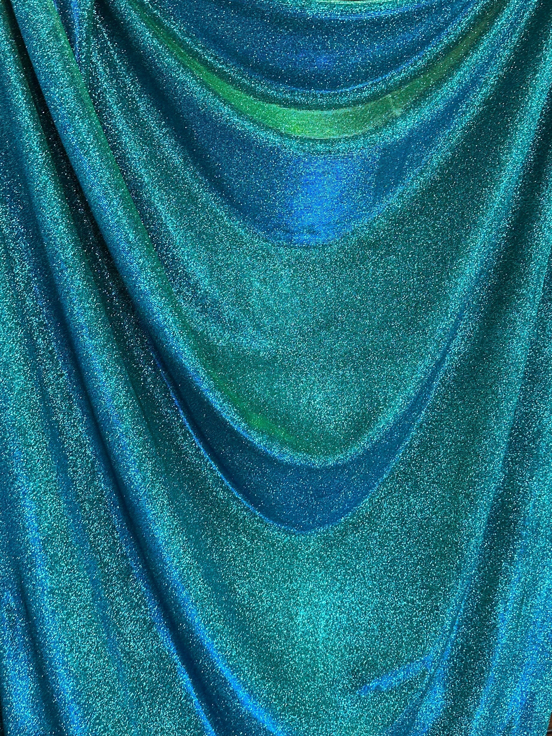 teal iridescent metallic lurex, teal blue lurex, teal green lurex fabric, lurex fabric by the yard, teal material, fabric store, luxury fabrics, cheap fabric, glittery fabric, sparkle fabric, glimmery fabric, shimmery fabric