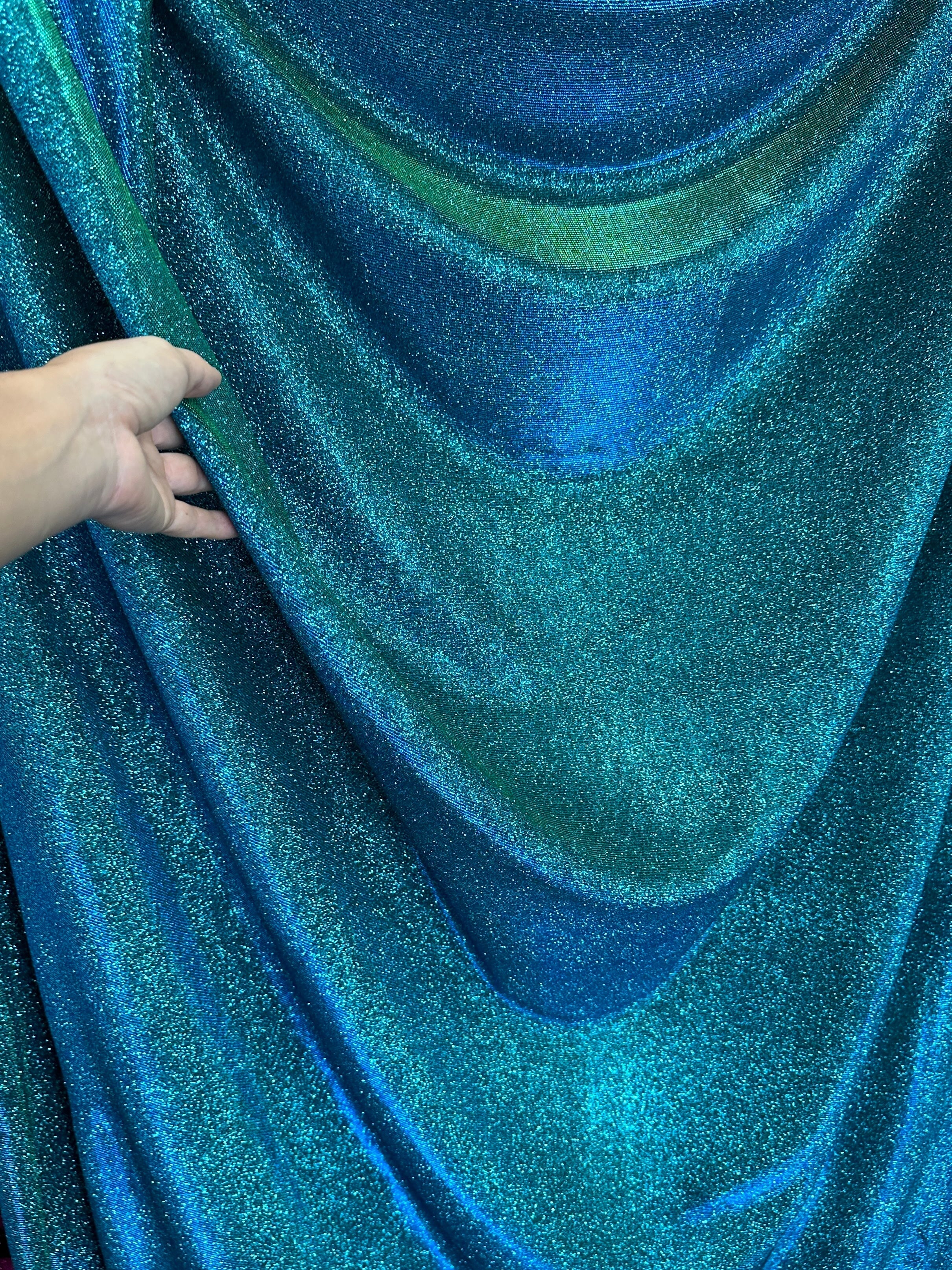 teal iridescent metallic lurex, teal blue lurex, teal green lurex fabric, lurex fabric by the yard, teal material, fabric store, luxury fabrics, cheap fabric, glittery fabric, sparkle fabric, glimmery fabric, shimmery fabric