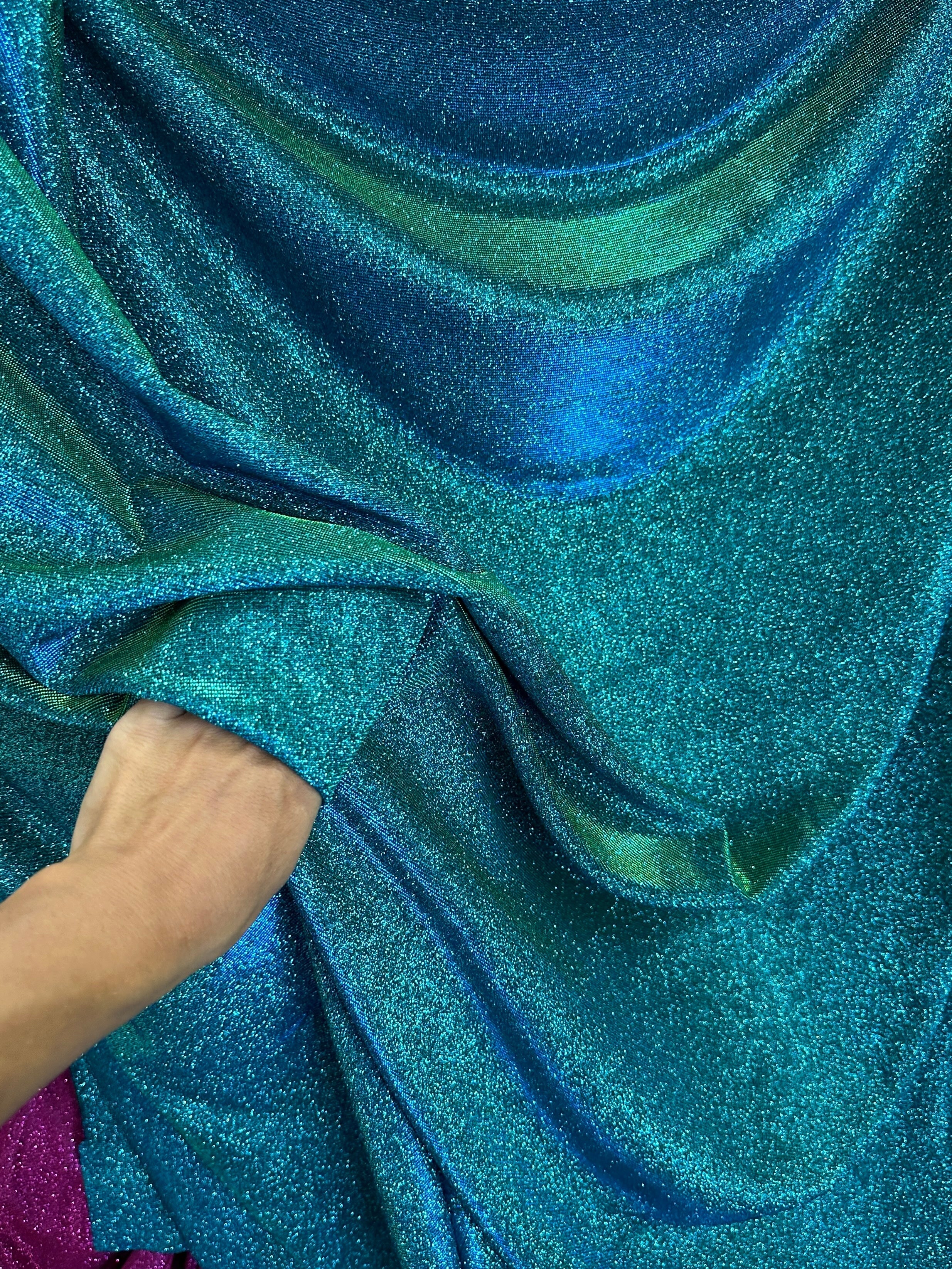 teal iridescent metallic lurex, teal blue lurex, teal green lurex fabric, lurex fabric by the yard, teal material, fabric store, luxury fabrics, cheap fabric, glittery fabric, sparkle fabric, glimmery fabric, shimmery fabric