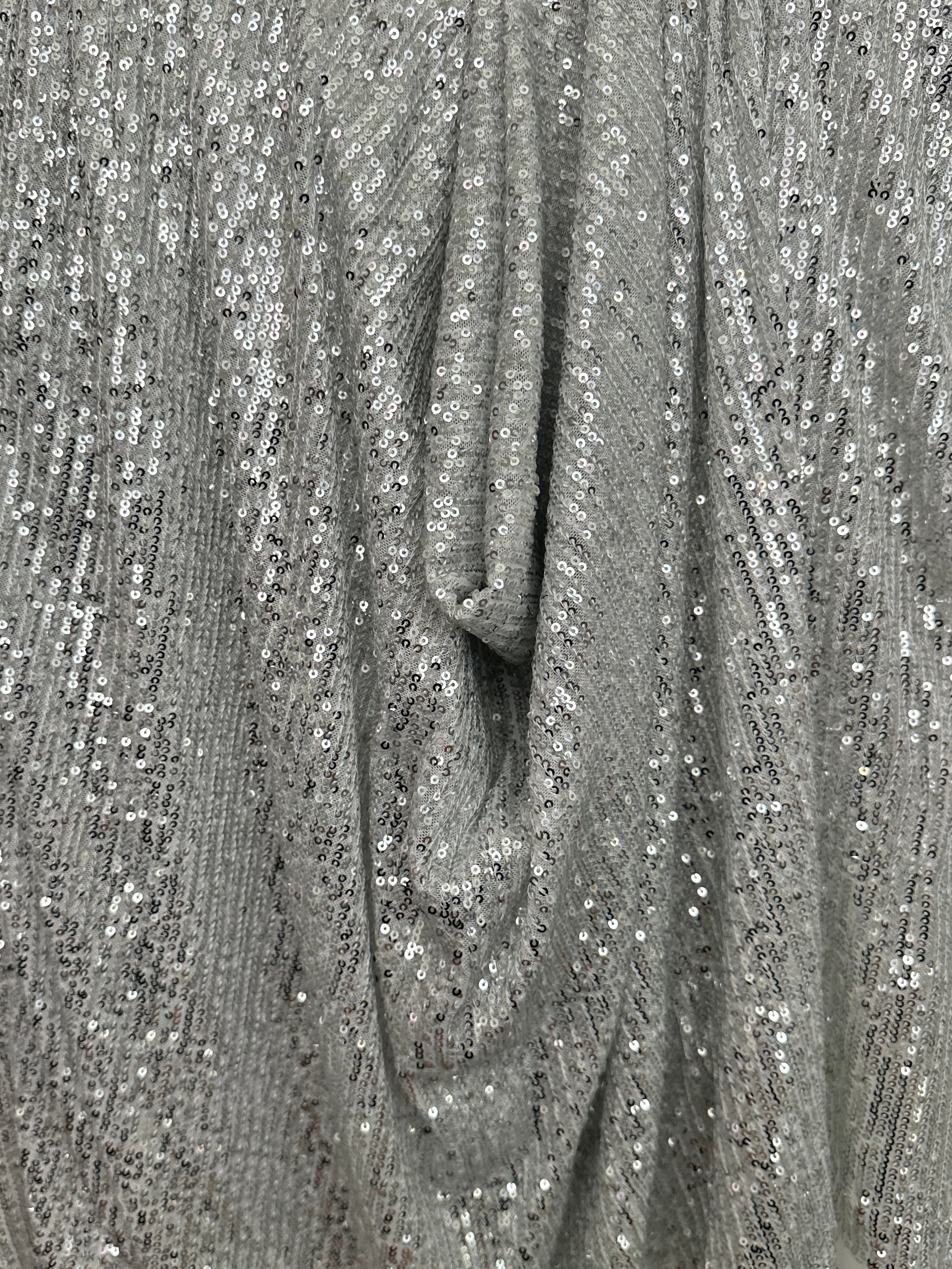 silver super stretch sequin on mesh, light silver sequin on mesh, light silver sequin on mesh, sequin on mesh for woman, sequin on mesh for bride, sequin on mesh on discount, sequin on mesh on sale, premium sequin on mesh, kiki textile sequin on mesh, sequin on mesh for party wear