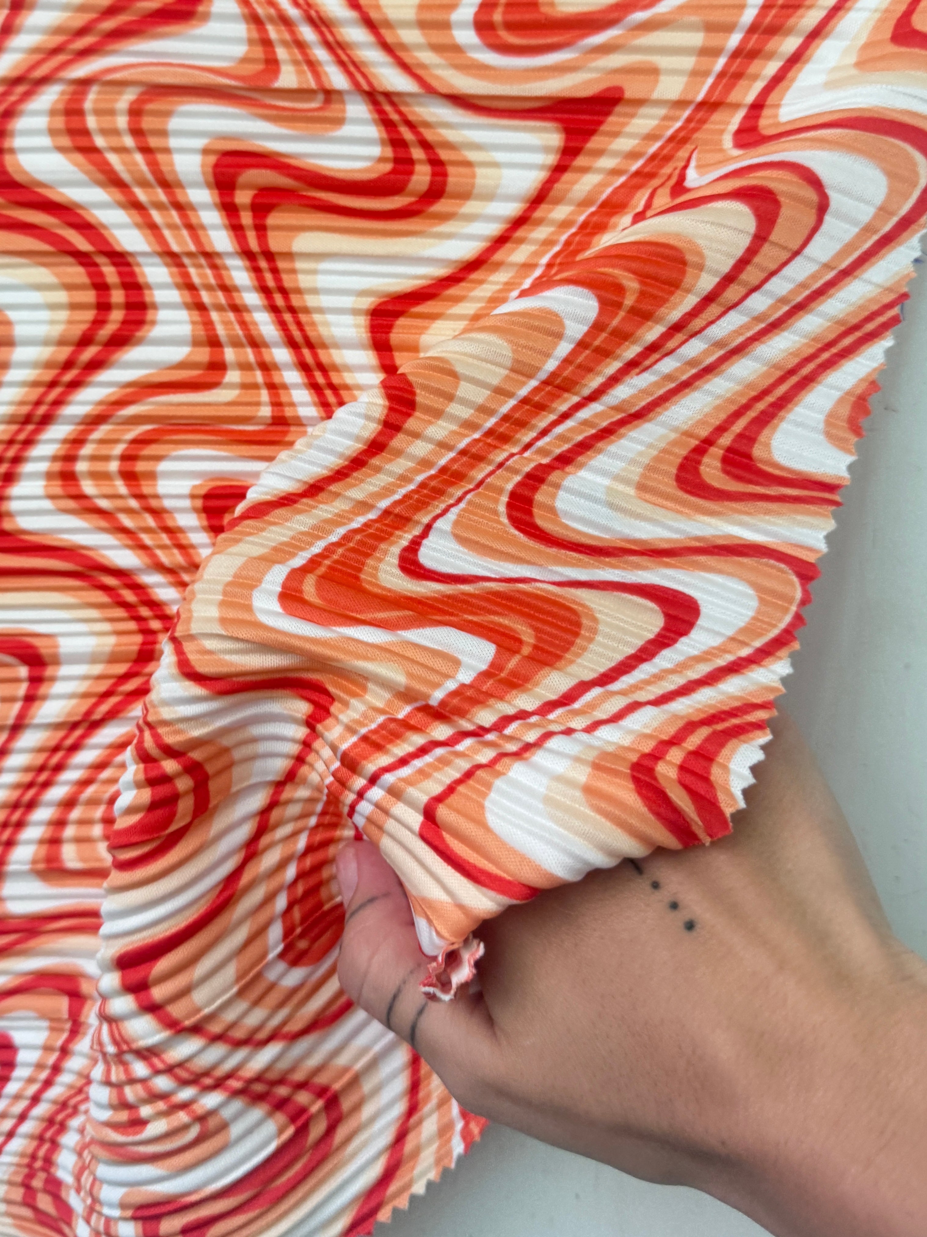 Orange Print Pleated Knit, online textile store, sewing, fabric store, sewing store, cheap fabric store, kiki textiles