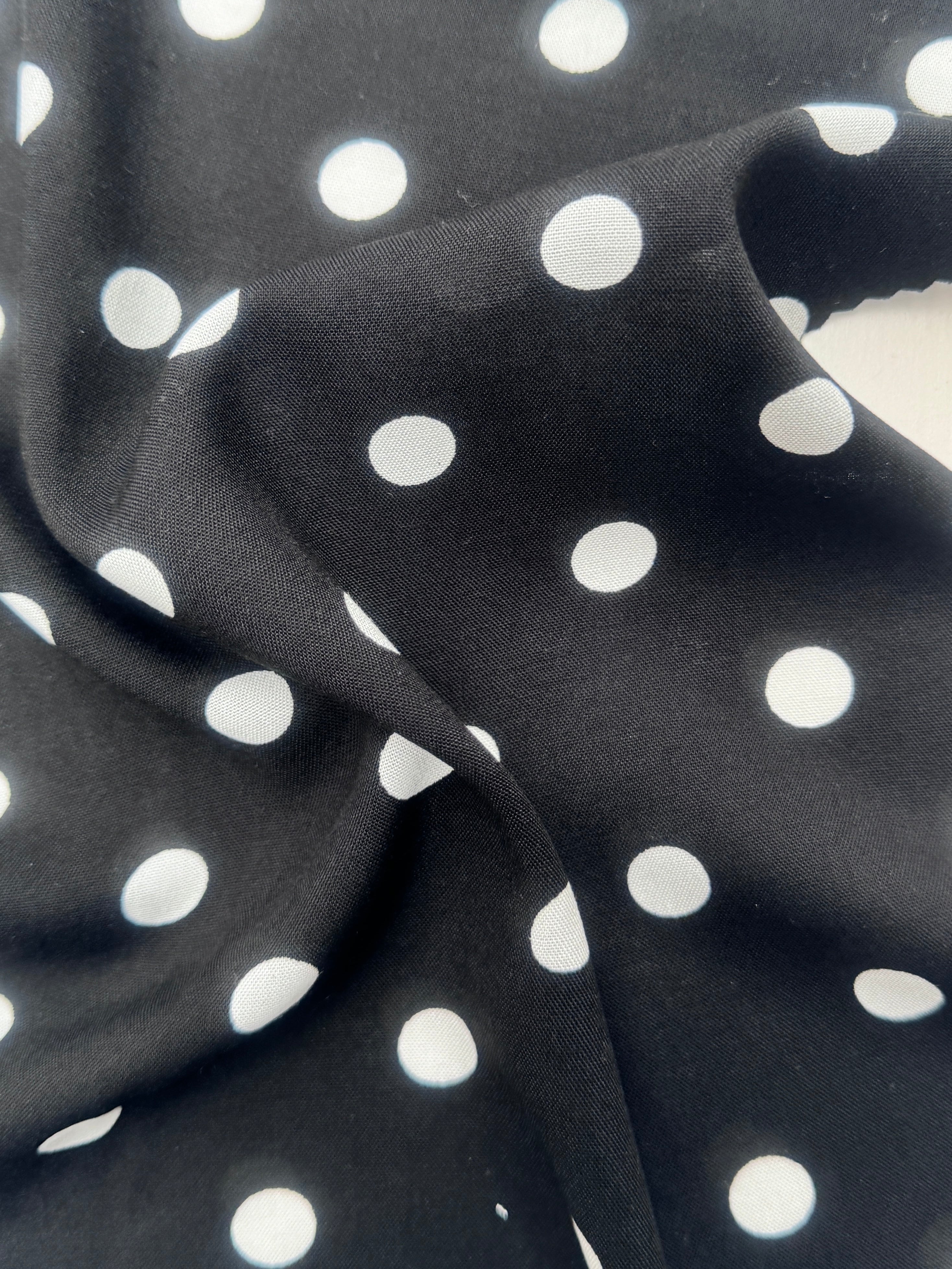 White polka dots on black rayon challis, Black Rayon Challis, Black and white Rayon Challis, eco-friendly fabric, pure Rayon Challis fabric, Rayon Challis, Rayon Challis fabric, kiki textiles, sewing