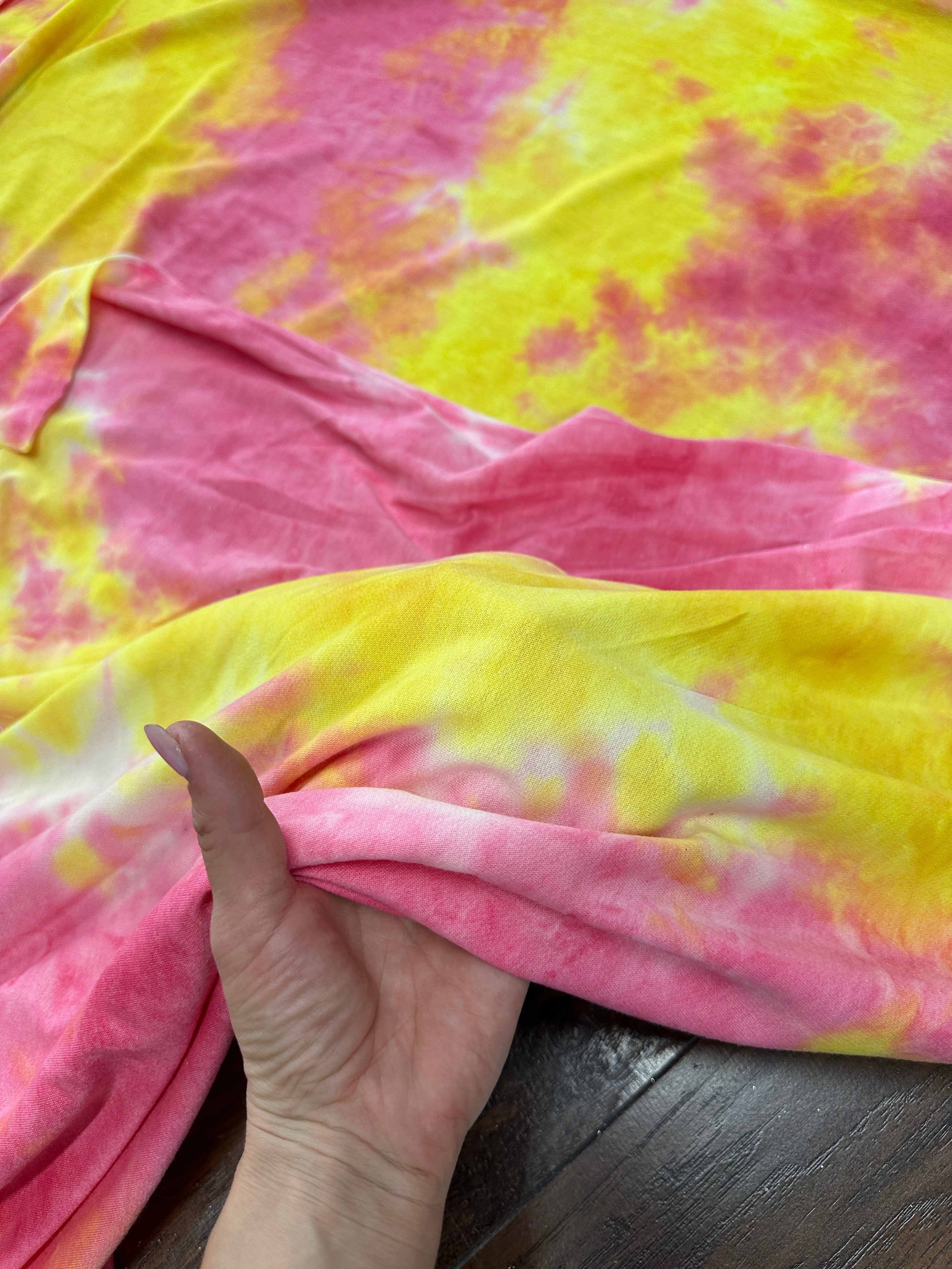 Yellow and Pink Tie Dye Jersey Knit, tie dye jersey knit for woman, tie dye jersey knit for party wear, tie dye jersey knit for gown, tie dye jersey knit for bride, tie dye jersey knit on discount, tie dye jersey knit on sale, premium tie dye jersey knit