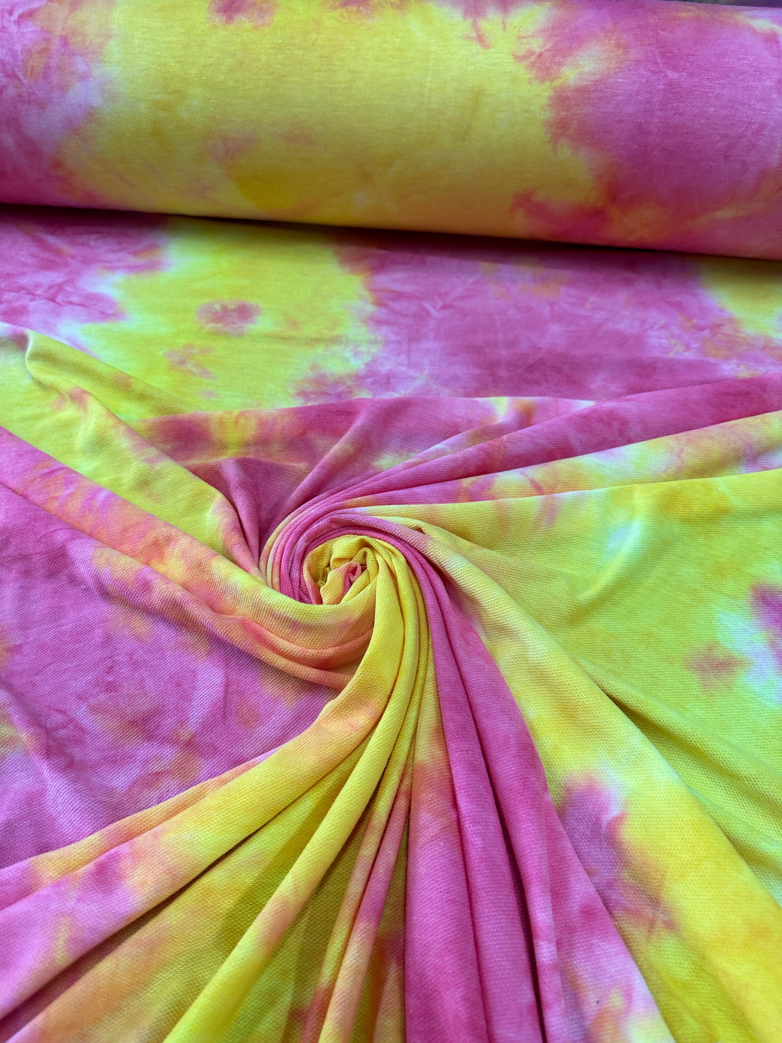 Yellow and Pink Tie Dye Jersey Knit, tie dye jersey knit for woman, tie dye jersey knit for party wear, tie dye jersey knit for gown, tie dye jersey knit for bride, tie dye jersey knit on discount, tie dye jersey knit on sale, premium tie dye jersey knit