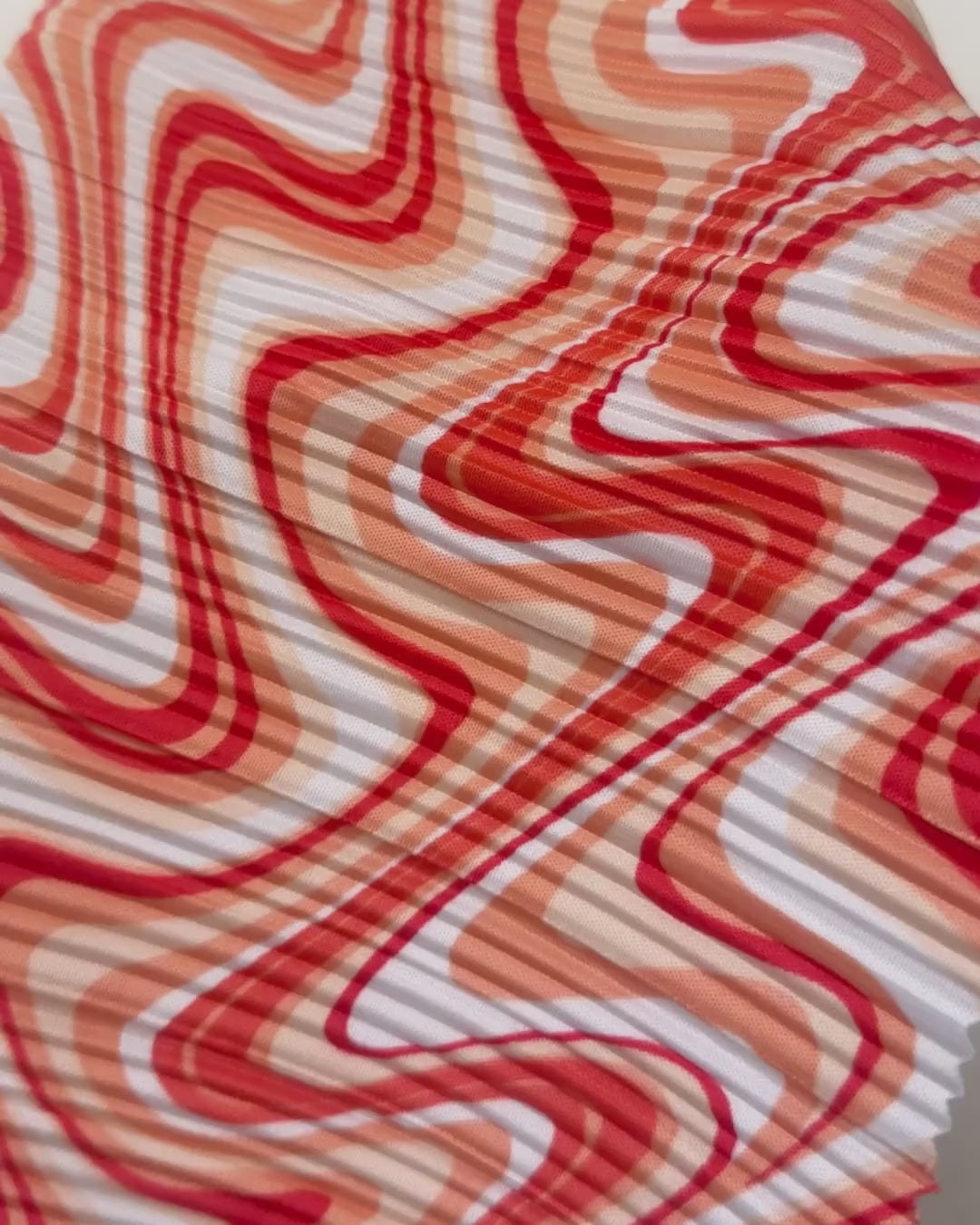 orange print Pleated Knit, orange pleated knit, orange textured knit, printed fabric, print pleated fabric, pleated spandex, spandex fabric, kiki textiles, sewing