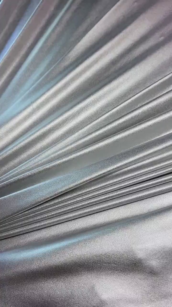 Silver Slinky Foiled Jersey, dark silver Slinky Foiled Jersey, light silver Slinky Foiled Jersey, grey Slinky Foiled Jersey for woman, Slinky Foiled Jersey for bride, Slinky Foiled Jersey on discount, Slinky Foiled Jersey on sale, premium Slinky Foiled Jersey, kiki textile Slinky Foiled Jersey, Slinky Foiled Jersey for party wear, Slinky Foiled Jersey for winter