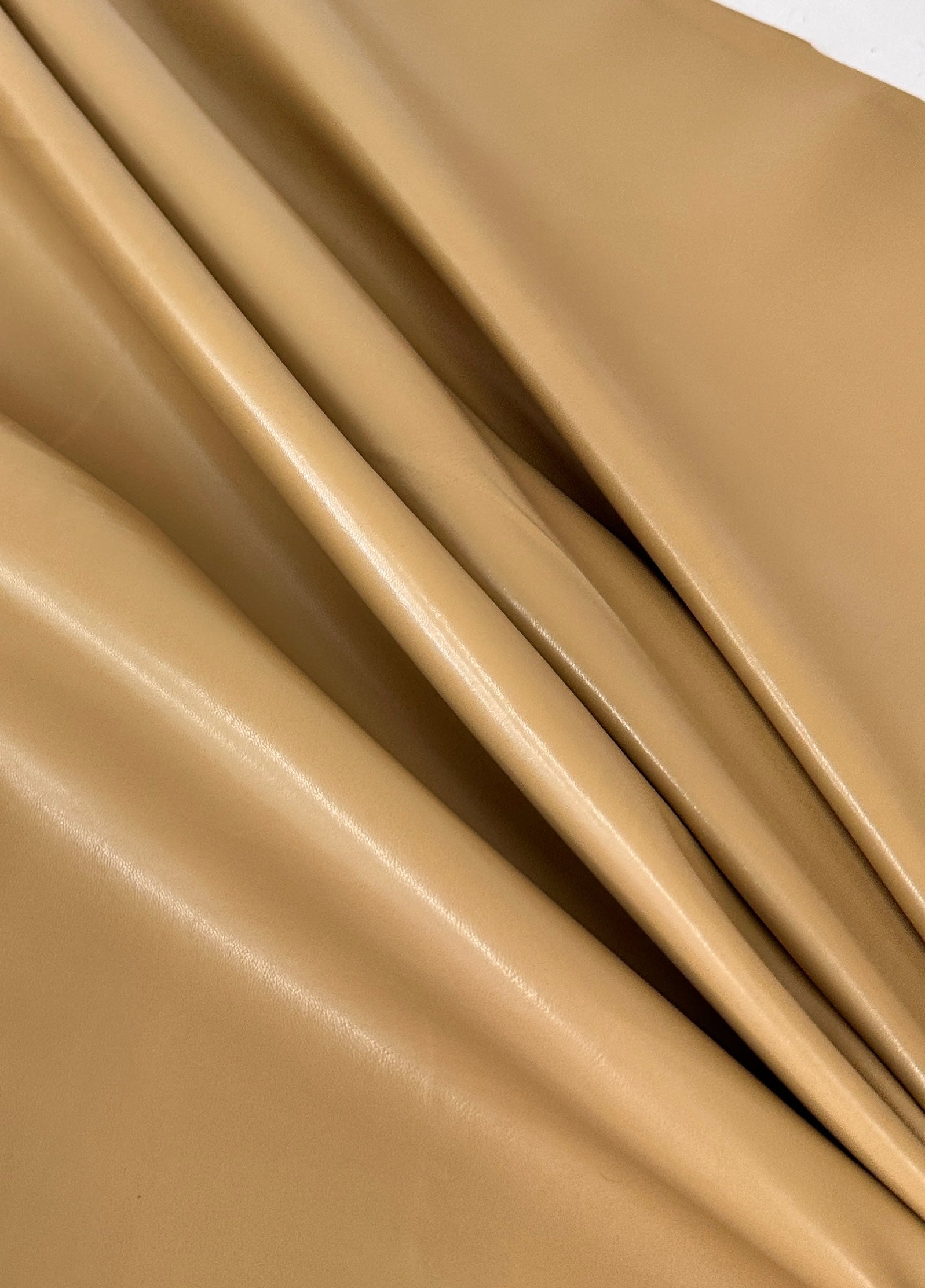 caramel Stretch Faux Leather, light brown stretch faux leather, cream color stretch faux leather, faux leather for woman, faux leather for costumes, faux leather for home decor, 2 way stretch faux leather, leather for blazers, cheap leather, discounted leather, leather on sale