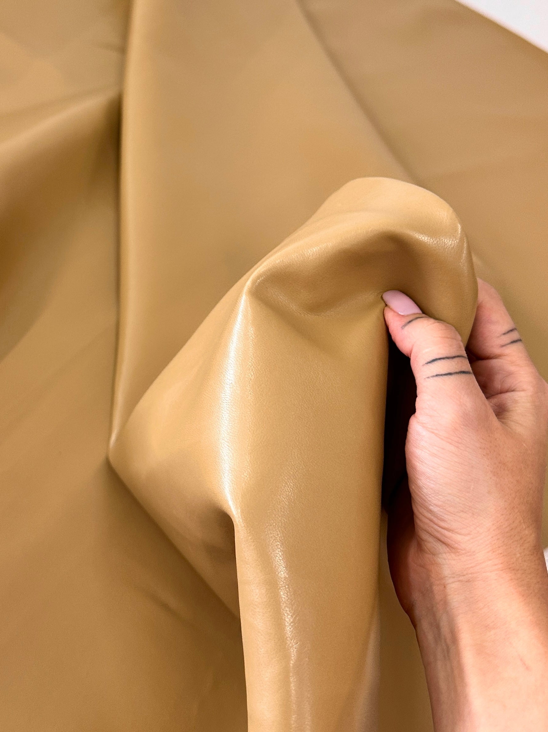 caramel Stretch Faux Leather, light brown stretch faux leather, cream color stretch faux leather, faux leather for woman, faux leather for costumes, faux leather for home decor, 2 way stretch faux leather, leather for blazers, cheap leather, discounted leather, leather on sale