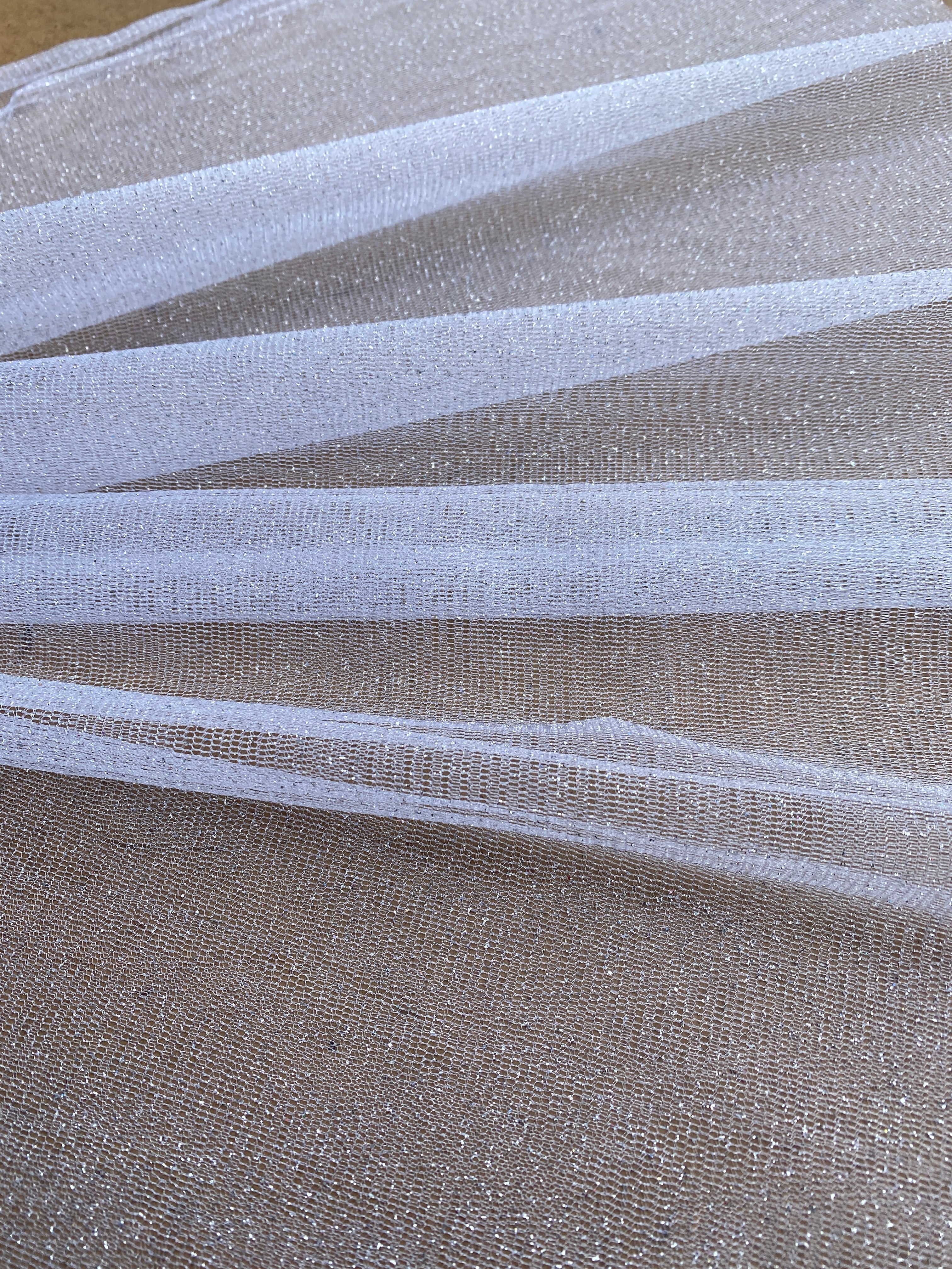 white glitter Tulle, bright white Tulle, off white tulle, milky white Tulle for party wear, white Tulle for dress, Tulle for woman, Tulle for bride, Tulle on discount, Tulle on sale, premium Tulle, buy Tulle online