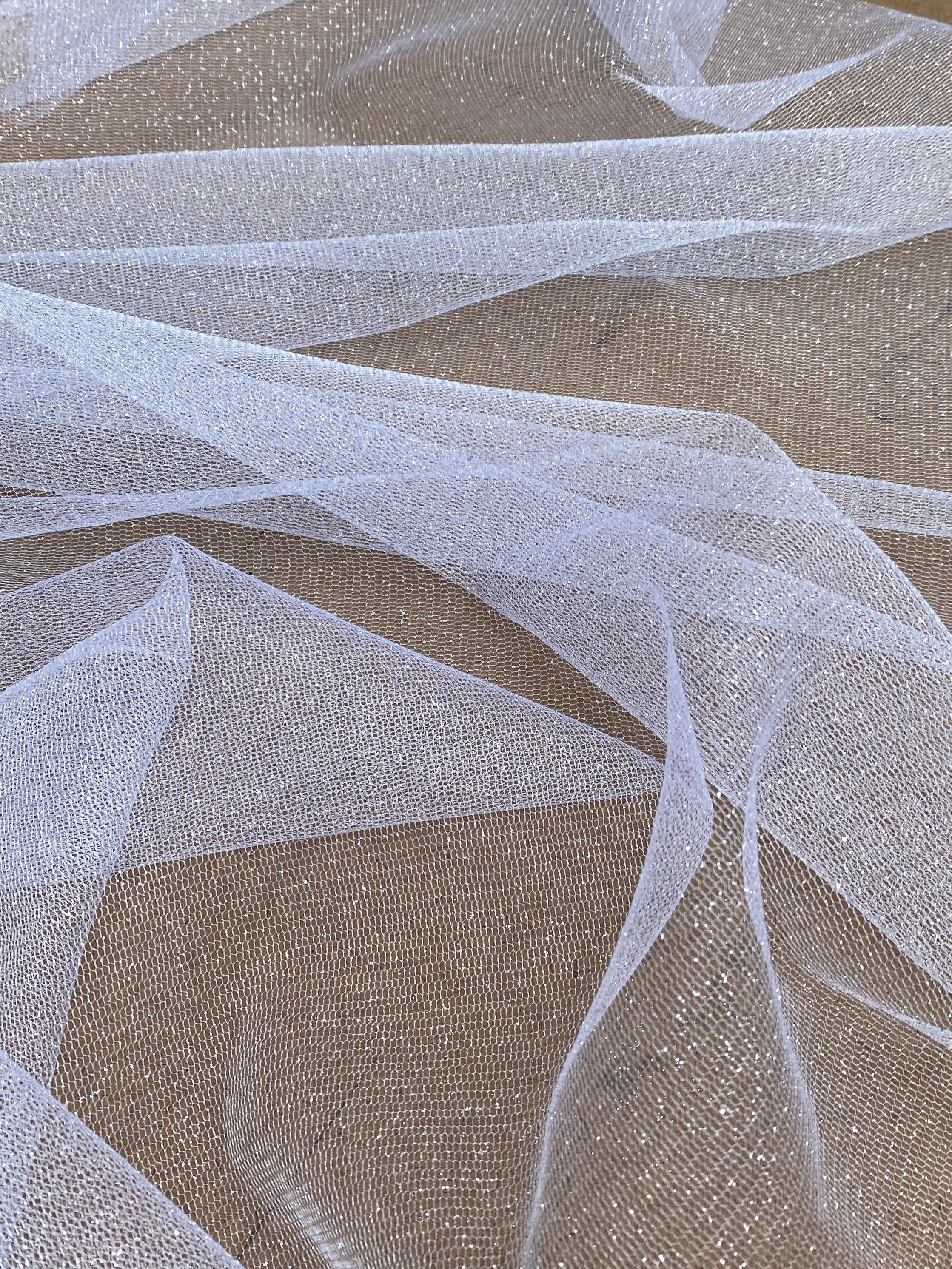 white glitter Tulle, bright white Tulle, off white tulle, milky white Tulle for party wear, white Tulle for dress, Tulle for woman, Tulle for bride, Tulle on discount, Tulle on sale, premium Tulle, buy Tulle online
