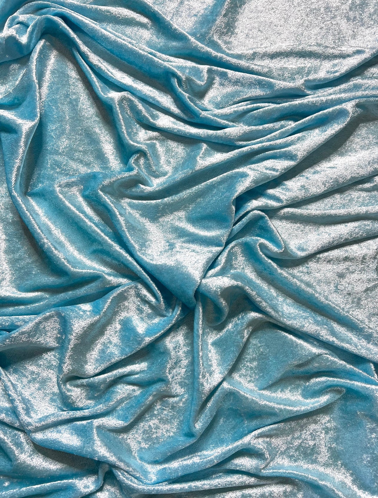 Turquois velvet,  light blue velvet, blue velvet, shinny blue velvet, sparkly blue velvet, velvet for woman, velvet for bride, velvet for party wear dresses, velvet on discount, velvet on sale, buy velvet online