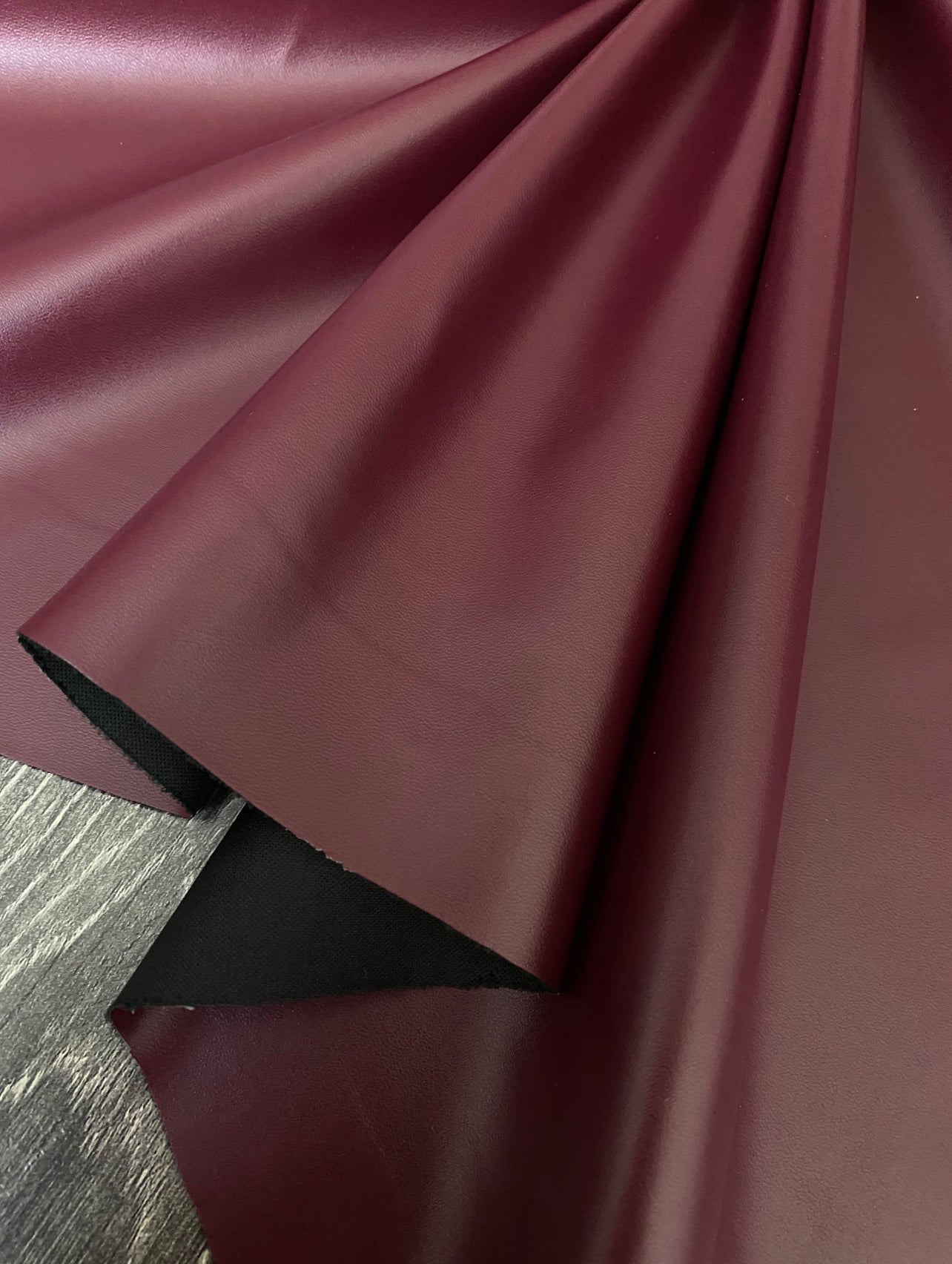 burgundy stretch faux leather, burgundy stretch pleather, burgundy stretch soft vinyl, burgundy stretch vinyl, faux leather stretch for clothing, Faux Leather for jackets, Faux Leather for bags, Faux Leather on discount, Faux Leather on sale, premium Faux Leather, burgundy Faux Leather, maroon Faux Leather, Faux Leather for tops, Faux Leather for leggings
