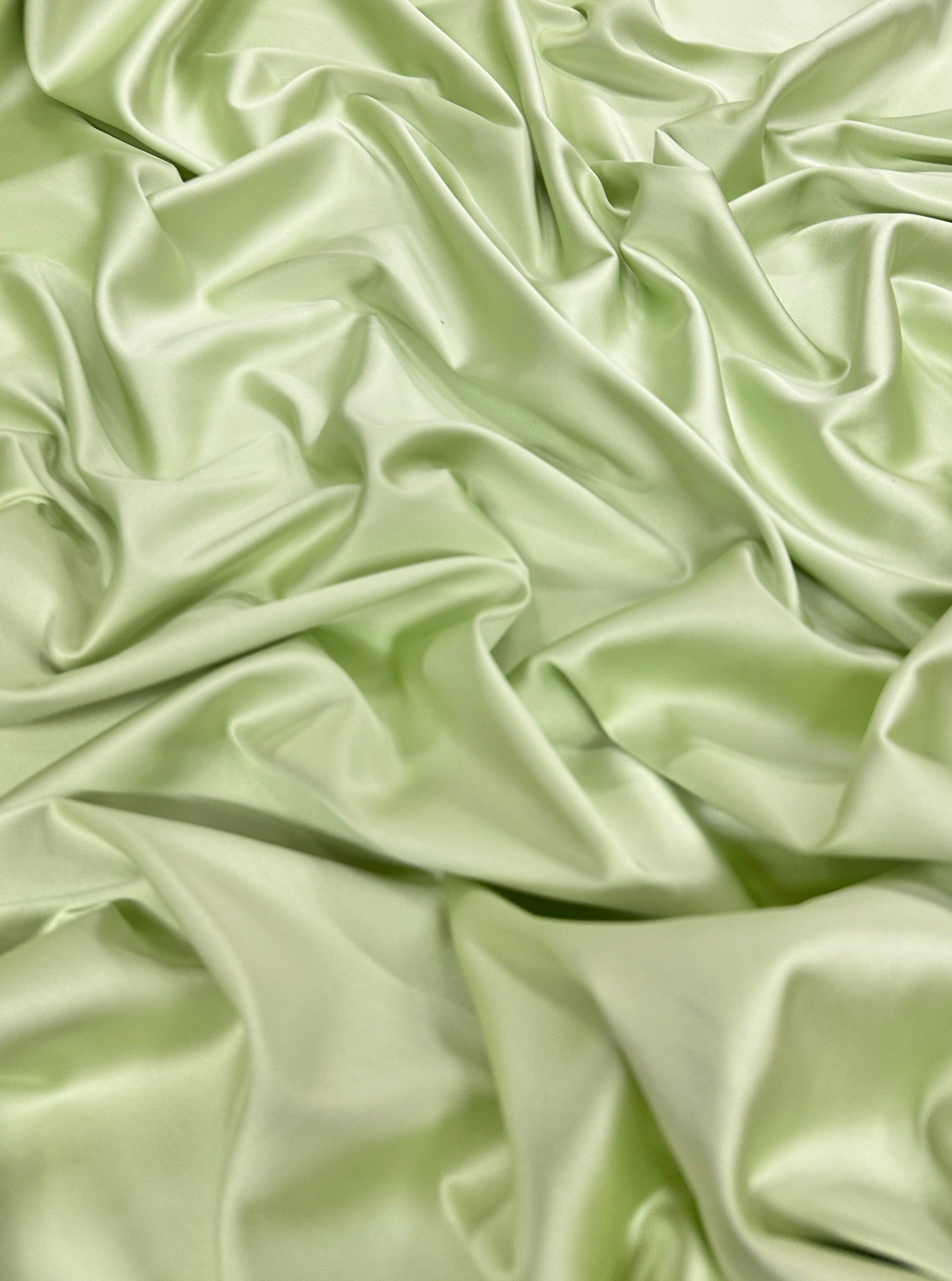 shiny silk fabric, solid silk, solid satin, stretch silk charmeuse, silk fabric by the yard, natural silk, pure silk, 100% pure silk, natural fabric, kiki textiles, online fabric store usa, luxurious fabric, silk satin online, fancy silk, soft silk, smooth silk, 100% natural silk, charmeuse satin, green natural silk, green silk, pistachio natural silk, pistachio silk, green natural stretch silk, pistachio silk, pistachio silk, baby pink silk, green silk satin, pistachio silk satin, light green silk