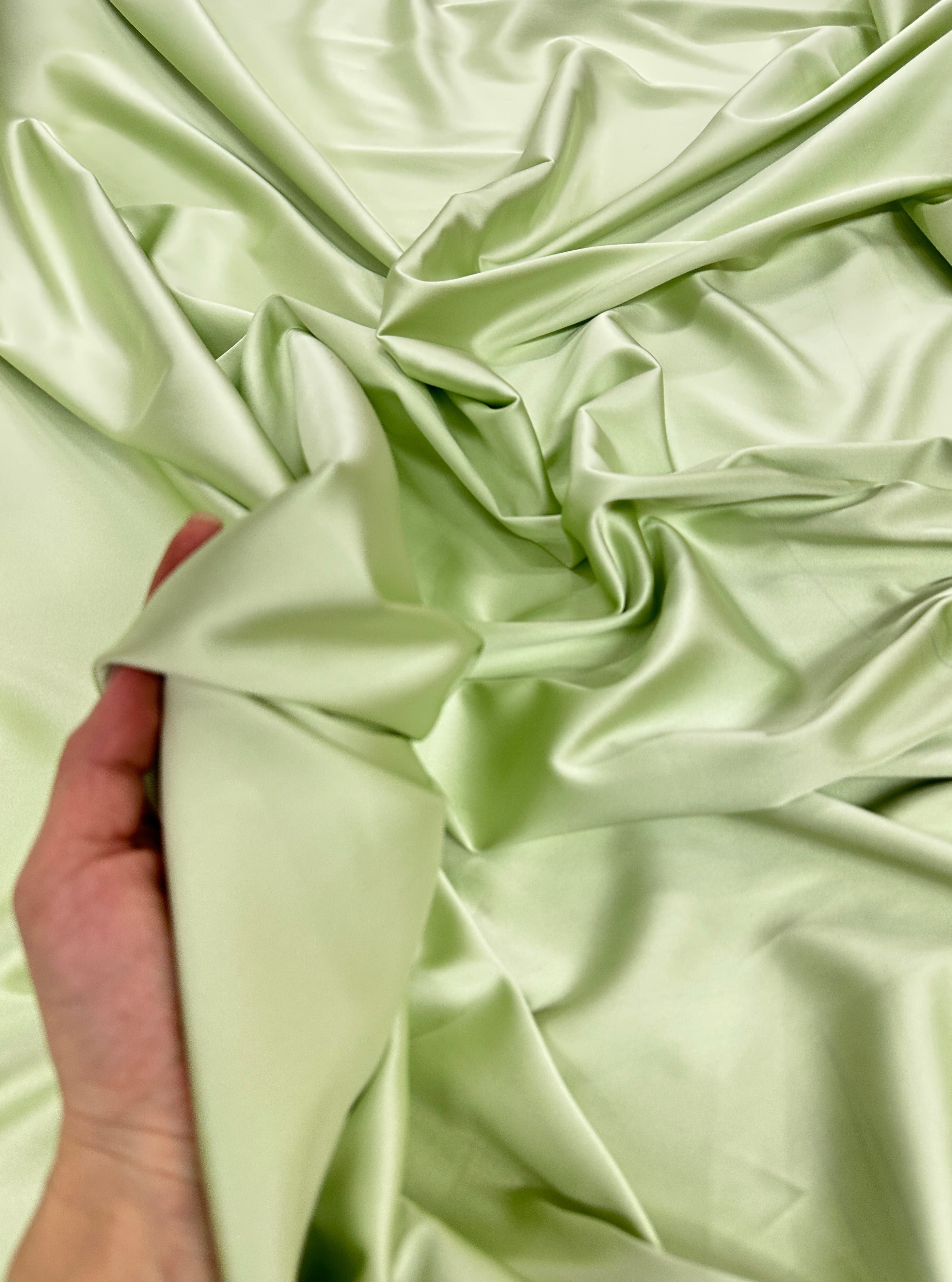 shiny silk fabric, solid silk, solid satin, stretch silk charmeuse, silk fabric by the yard, natural silk, pure silk, 100% pure silk, natural fabric, kiki textiles, online fabric store usa, luxurious fabric, silk satin online, fancy silk, soft silk, smooth silk, 100% natural silk, charmeuse satin, green natural silk, green silk, pistachio natural silk, pistachio silk, green natural stretch silk, pistachio silk, pistachio silk, baby pink silk, green silk satin, pistachio silk satin, light green silk