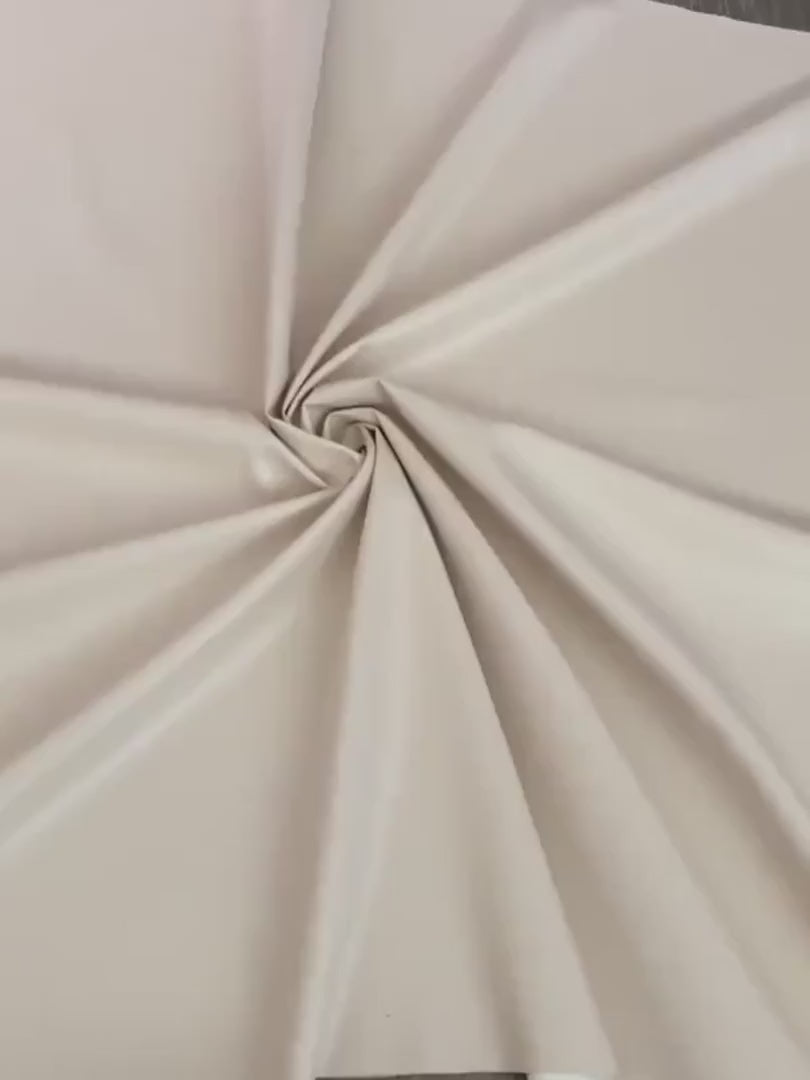 beige stretch faux leather, beige stretch pleather, beige stretch soft vinyl, beige stretch vinyl, faux leather stretch for clothing, Faux Leather for jackets, Faux Leather for bags, Faux Leather on discount, Faux Leather on sale, premium Faux Leather, light color Faux Leather, Faux Leather for tops, Faux Leather for leggings
