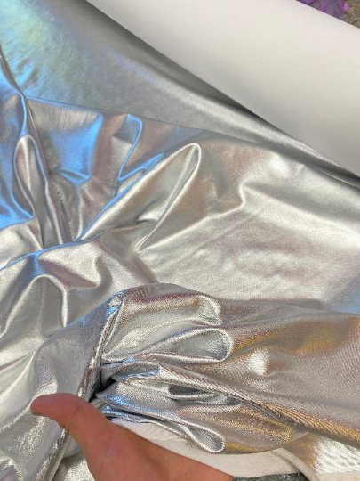 Silver Slinky Foiled Jersey, dark silver Slinky Foiled Jersey, light silver Slinky Foiled Jersey, grey Slinky Foiled Jersey for woman, Slinky Foiled Jersey for bride, Slinky Foiled Jersey on discount, Slinky Foiled Jersey on sale, premium Slinky Foiled Jersey, kiki textile Slinky Foiled Jersey, Slinky Foiled Jersey for party wear, Slinky Foiled Jersey for winter