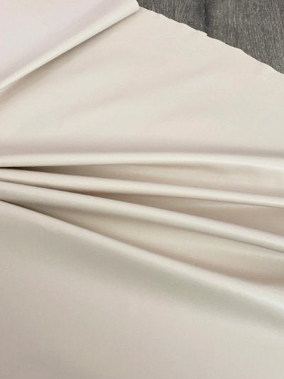 beige stretch faux leather, beige stretch pleather, beige stretch soft vinyl, beige stretch vinyl, faux leather stretch for clothing, Faux Leather for jackets, Faux Leather for bags, Faux Leather on discount, Faux Leather on sale, premium Faux Leather, light color Faux Leather, Faux Leather for tops, Faux Leather for leggings