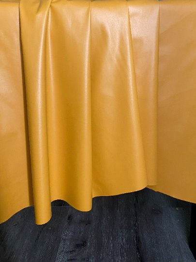 mustard stretch Faux Leather, dark orange leather, shiny faux leather, orange faux leather for woman, faux leather for costumes, faux leather for home decor, 2 way stretch faux leather, leather for blazers, cheap leather, discounted leather, leather on sale