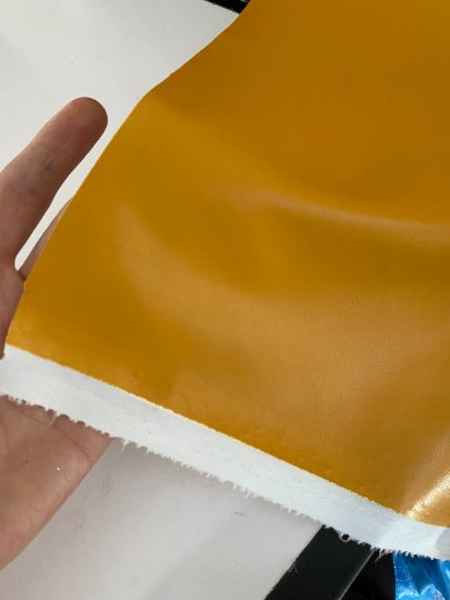 mustard stretch Faux Leather, dark orange leather, shiny faux leather, orange faux leather for woman, faux leather for costumes, faux leather for home decor, 2 way stretch faux leather, leather for blazers, cheap leather, discounted leather, leather on sale