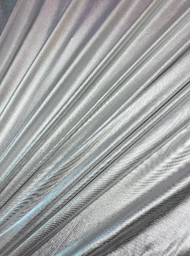 Silver Slinky Foiled Jersey, dark silver Slinky Foiled Jersey, light silver Slinky Foiled Jersey, grey Slinky Foiled Jersey for woman, Slinky Foiled Jersey for bride, Slinky Foiled Jersey on discount, Slinky Foiled Jersey on sale, premium Slinky Foiled Jersey, kiki textile Slinky Foiled Jersey, Slinky Foiled Jersey for party wear, Slinky Foiled Jersey for winter