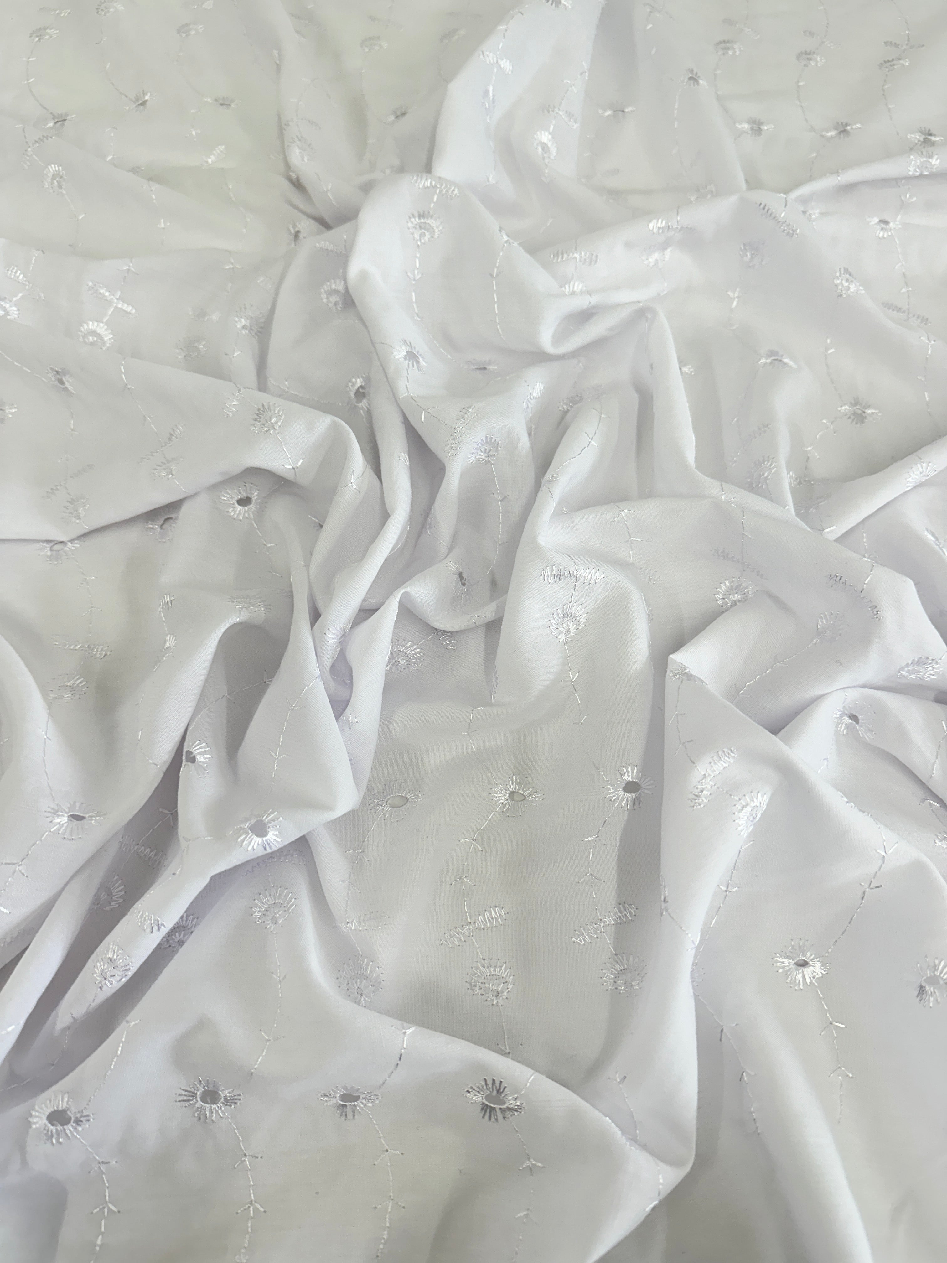 a closer look of white dainty cotton embrioidered eyelet 