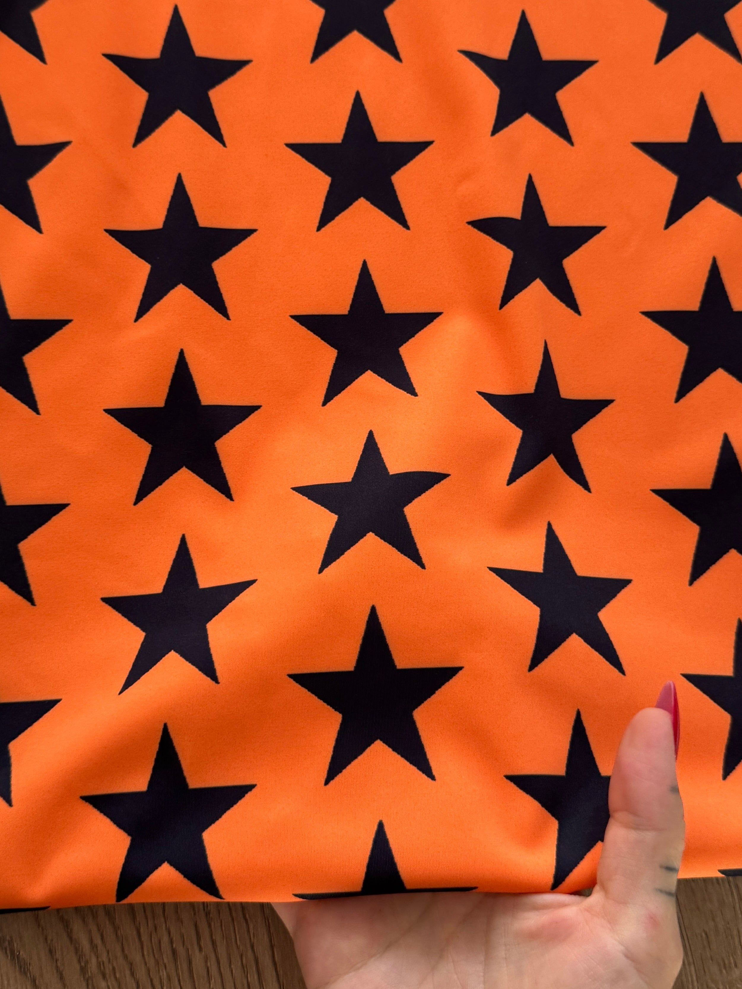 Black on Orange Star Print Nylon Spandex, Kiki Sewing Store, Kiki Luxury Fabric, Cheap Fabric Store, Kiki Textiles, Kiki Textile by the Yard, Kiki Textile USA