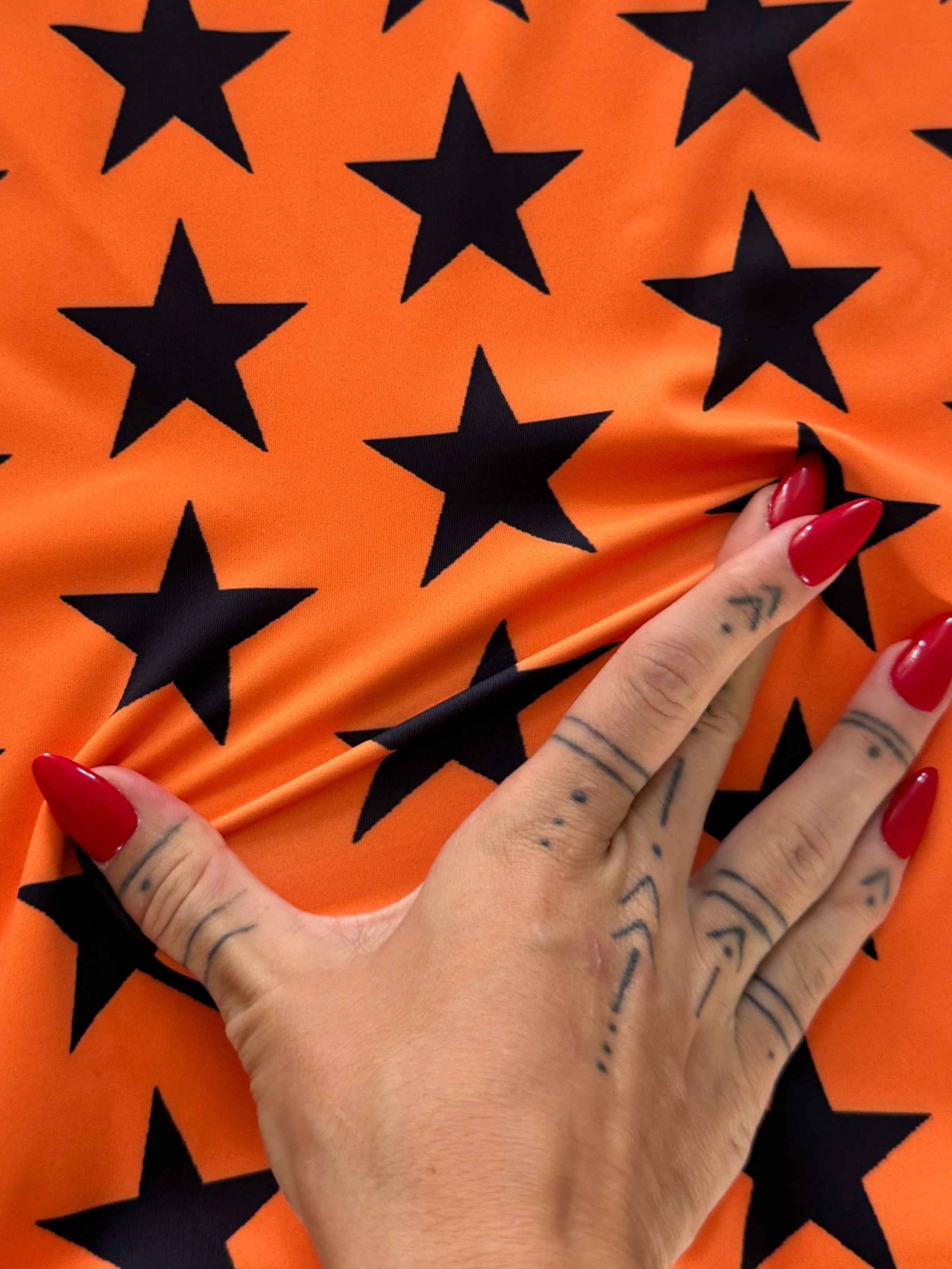 Black on Orange Star Print Nylon Spandex, Kiki Sewing Store, Kiki Luxury Fabric, Cheap Fabric Store, Kiki Textiles, Kiki Textile by the Yard, Kiki Textile USA