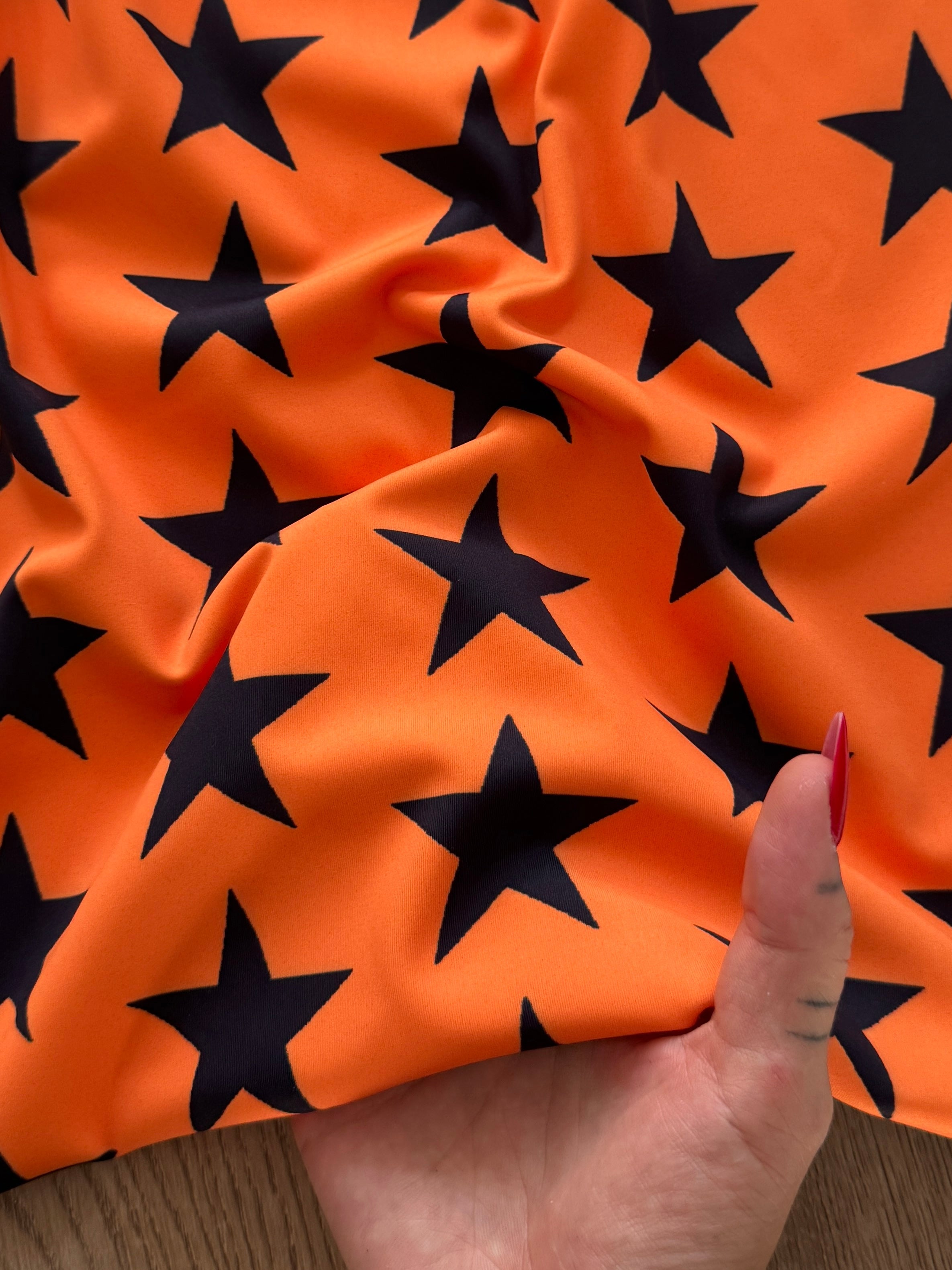 Black on Orange Star Print Nylon Spandex, Kiki Sewing Store, Kiki Luxury Fabric, Cheap Fabric Store, Kiki Textiles, Kiki Textile by the Yard, Kiki Textile USA