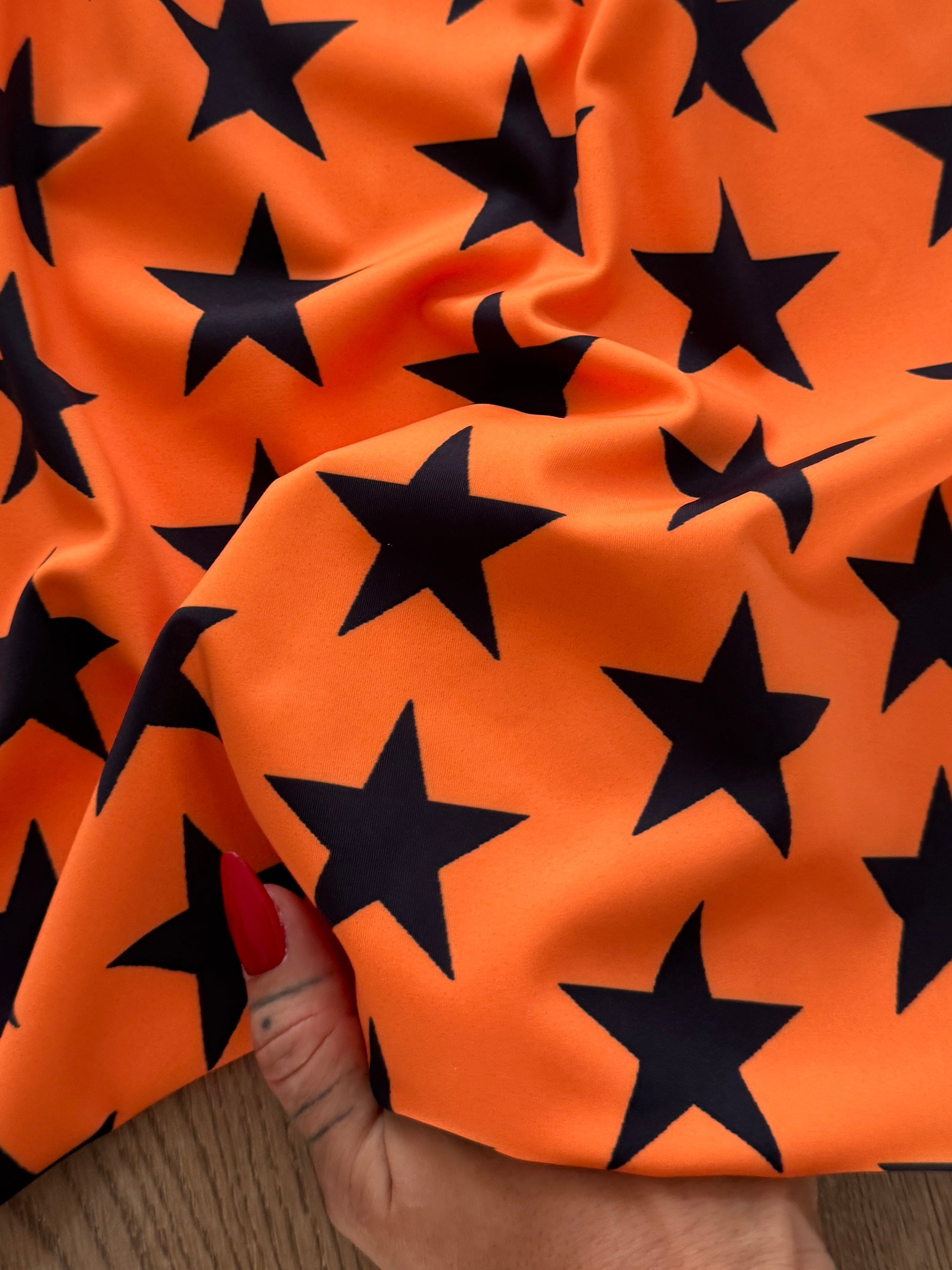 Black on Orange Star Print Nylon Spandex, Kiki Sewing Store, Kiki Luxury Fabric, Cheap Fabric Store, Kiki Textiles, Kiki Textile by the Yard, Kiki Textile USA