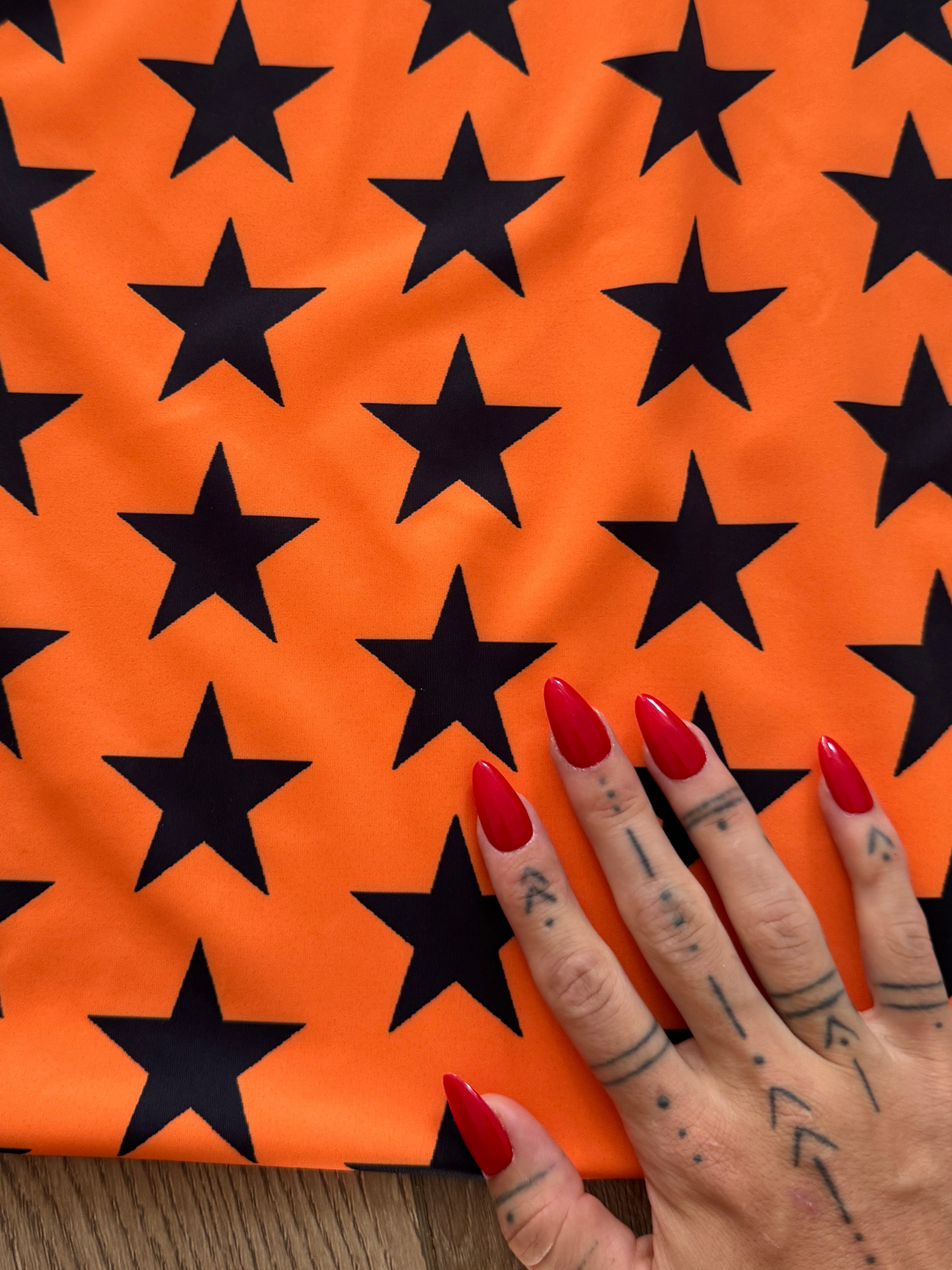 Black on Orange Star Print Nylon Spandex, Kiki Sewing Store, Kiki Luxury Fabric, Cheap Fabric Store, Kiki Textiles, Kiki Textile by the Yard, Kiki Textile USA