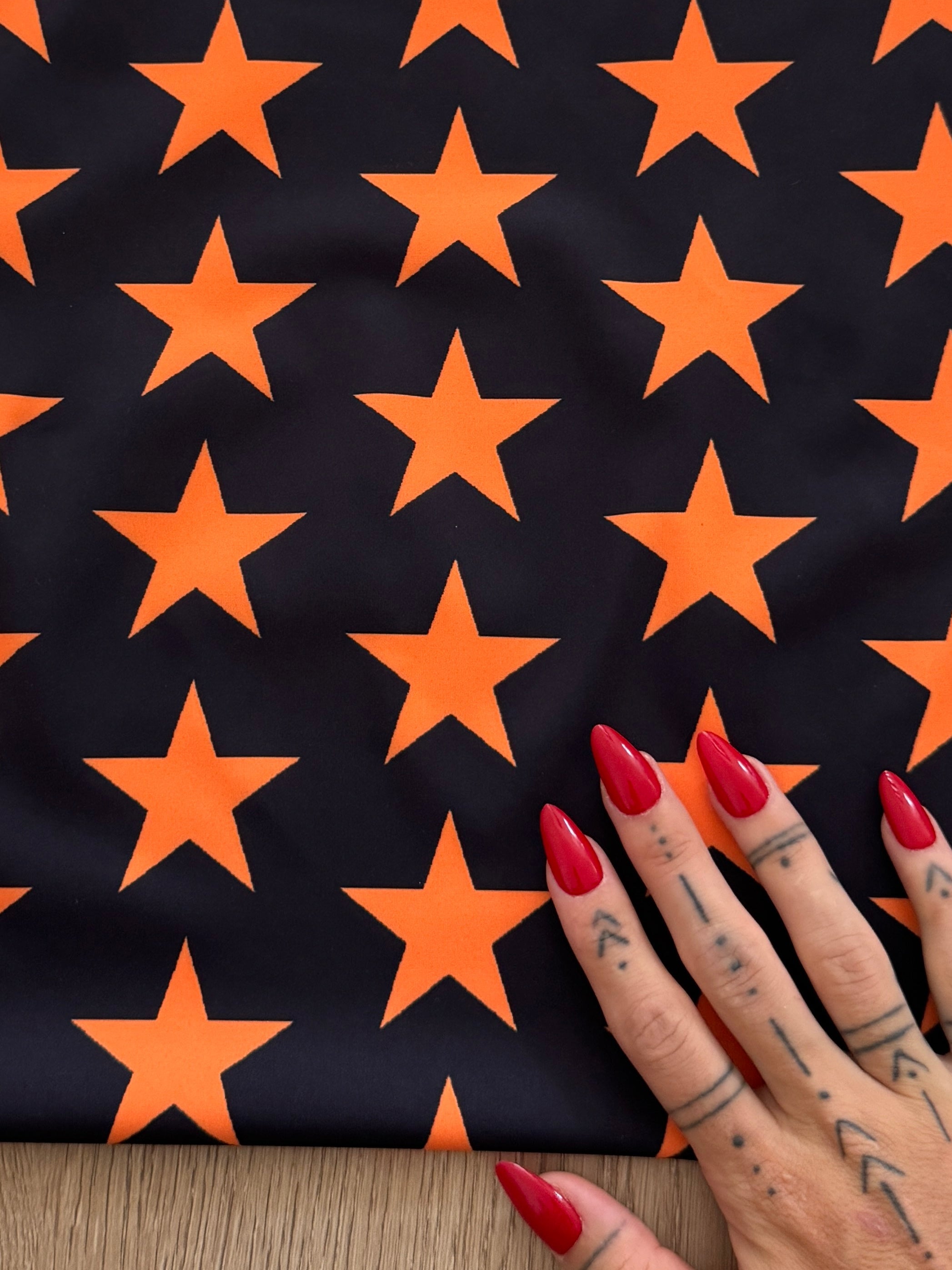 Orange on Black Star Print Nylon Spandex, Kiki Sewing Store, Kiki Luxury Fabric, Cheap Fabric Store, Kiki Textiles, Kiki Textile by the Yard, Kiki Textile USA
