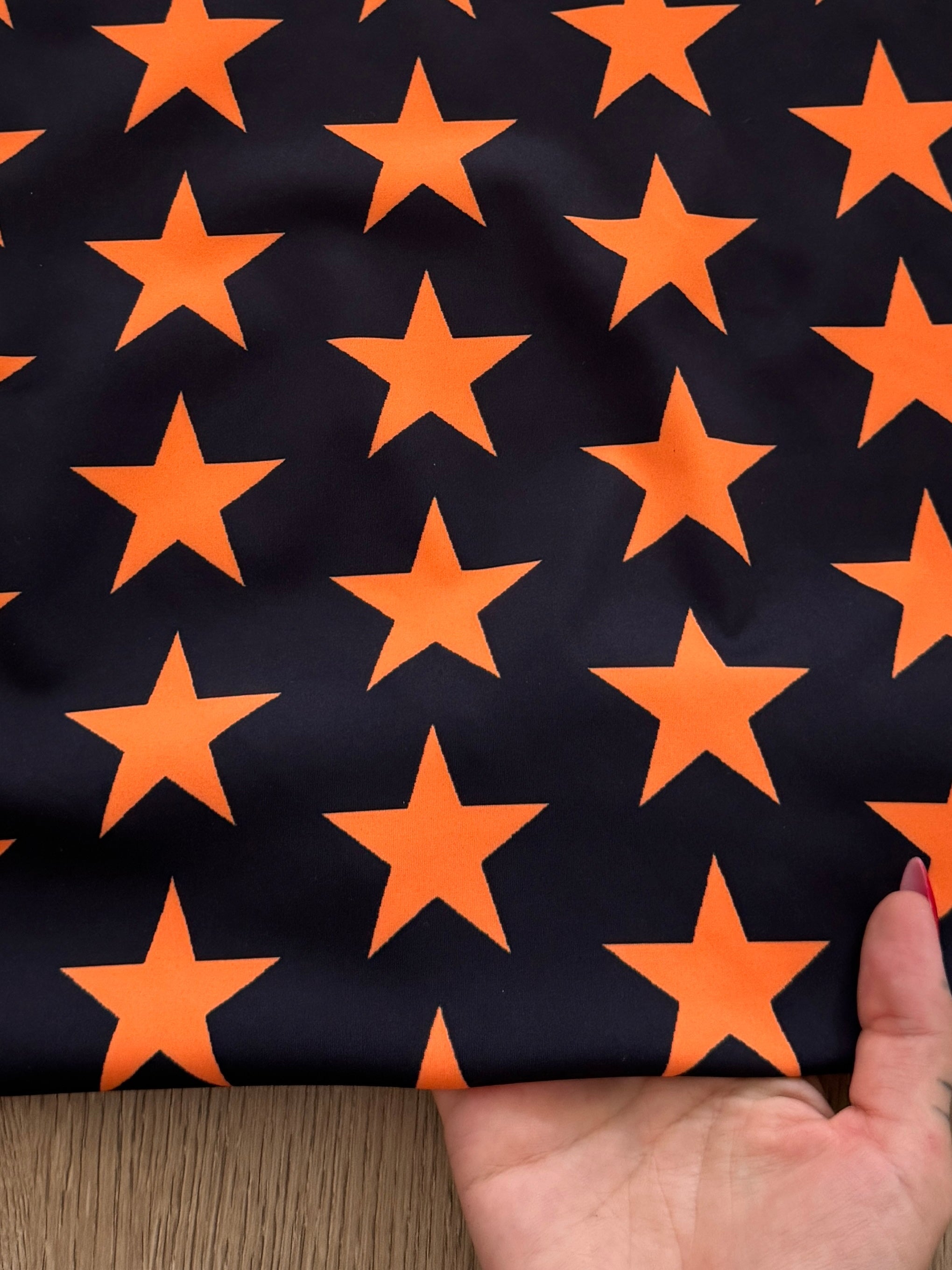 Orange on Black Star Print Nylon Spandex, Kiki Sewing Store, Kiki Luxury Fabric, Cheap Fabric Store, Kiki Textiles, Kiki Textile by the Yard, Kiki Textile USA