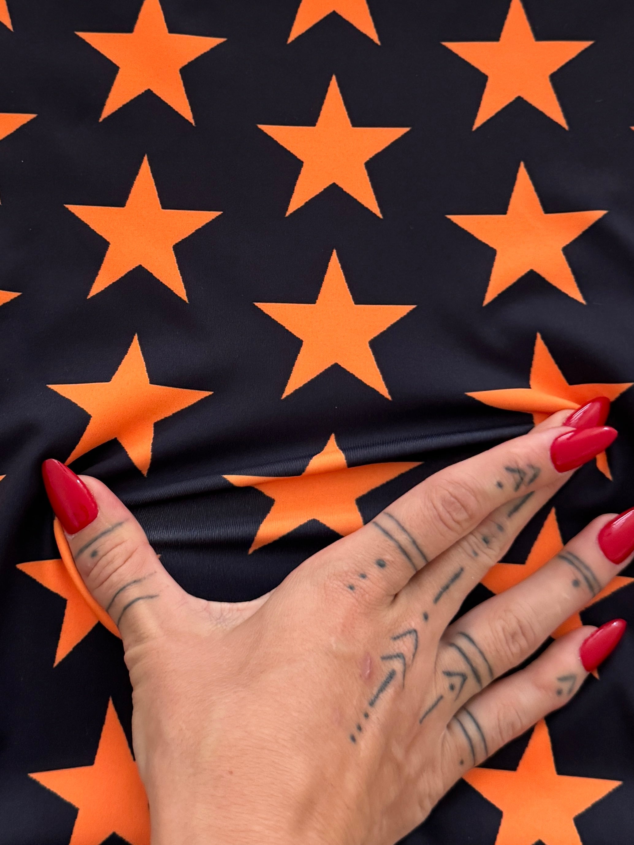 Orange on Black Star Print Nylon Spandex, Kiki Sewing Store, Kiki Luxury Fabric, Cheap Fabric Store, Kiki Textiles, Kiki Textile by the Yard, Kiki Textile USA