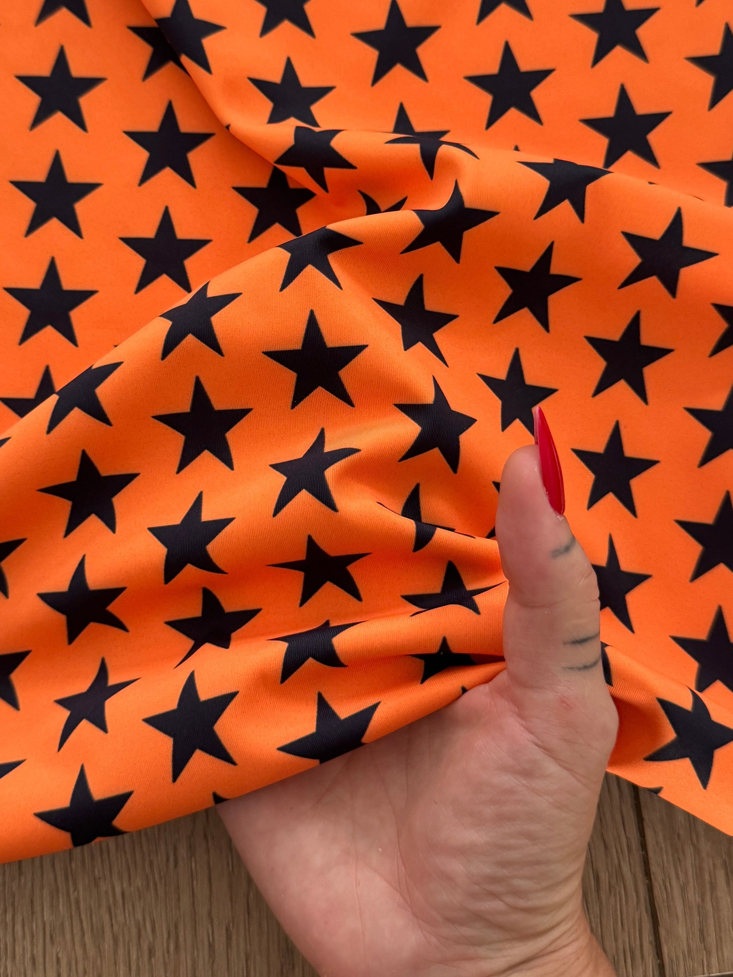 Black on Orange Mini Stars Print Nylon Spandex, Kiki Sewing Store, Kiki Luxury Fabric, Cheap Fabric Store, Kiki Textiles, Kiki Textile by the Yard, Kiki Textile USA