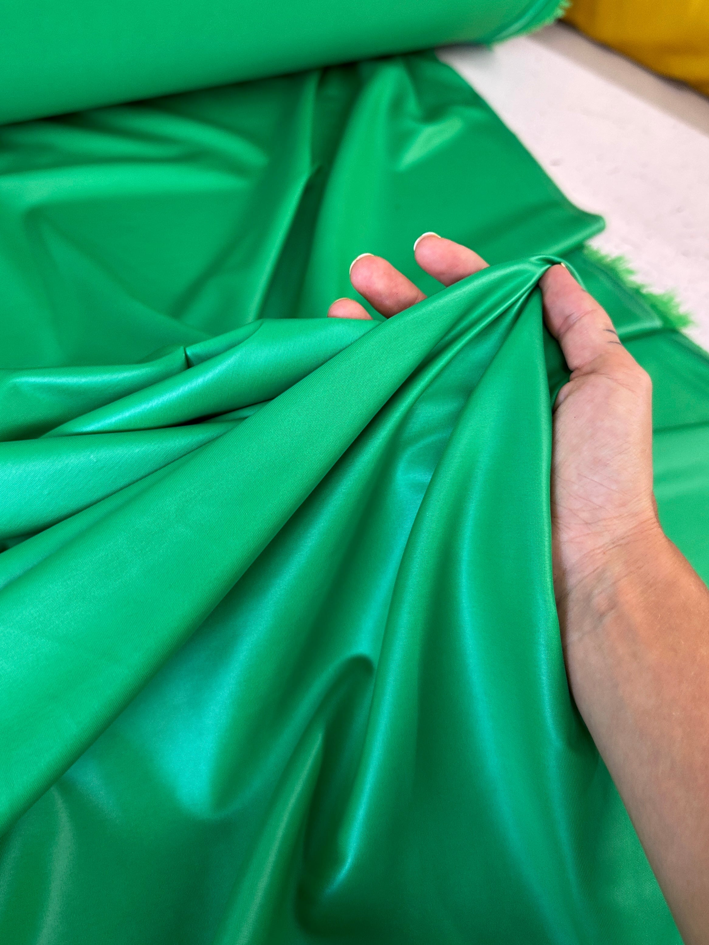 kelly green all way Stretch Faux Leather, green all way stretch leather, shiny faux leather, light green all way stretch faux leather for woman, faux leather for costumes, faux leather for home decor, 2 way stretch faux leather, leather for blazers, cheap leather, discounted leather, leather on sale