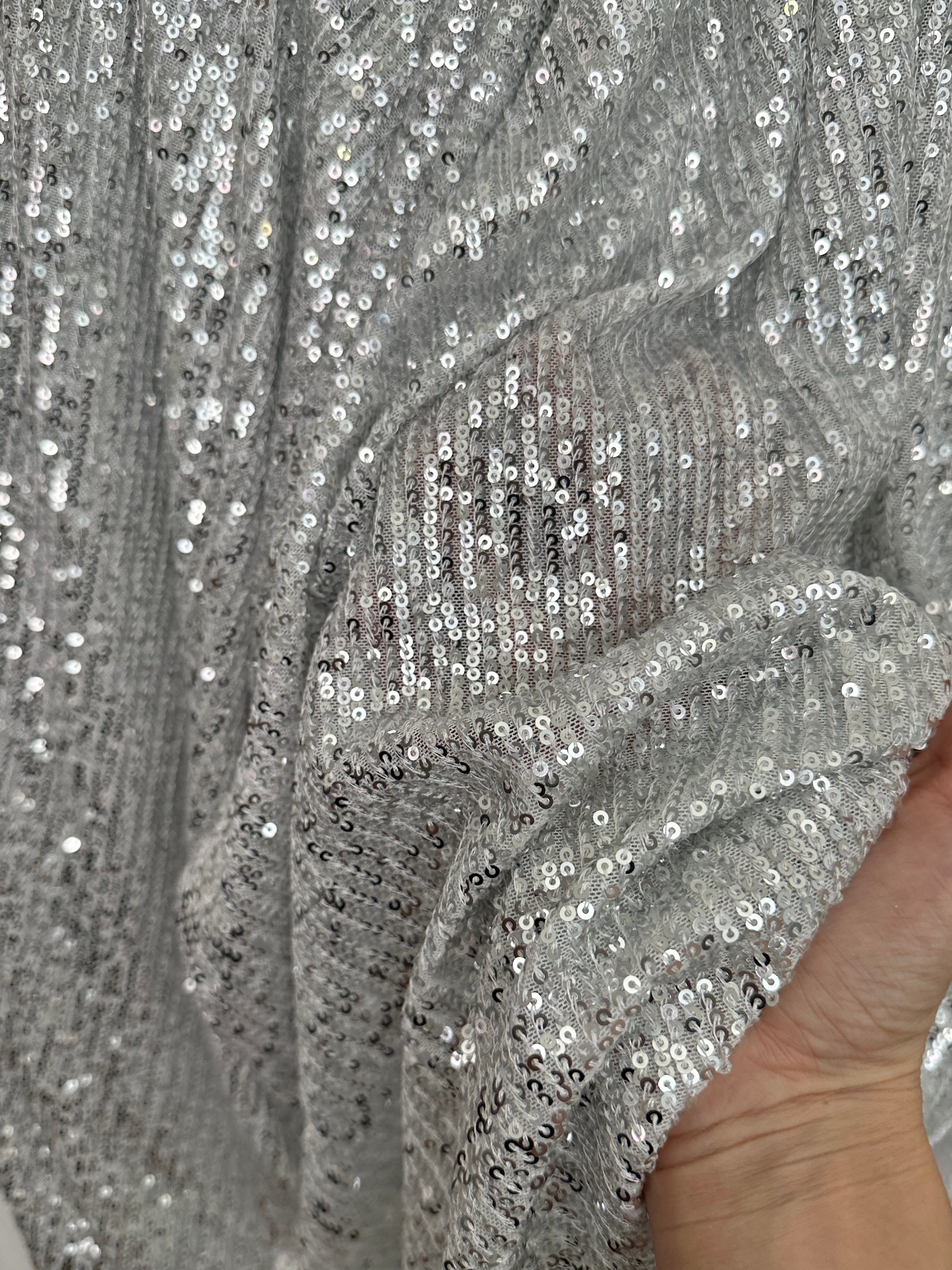 silver super stretch sequin on mesh, light silver sequin on mesh, light silver sequin on mesh, sequin on mesh for woman, sequin on mesh for bride, sequin on mesh on discount, sequin on mesh on sale, premium sequin on mesh, kiki textile sequin on mesh, sequin on mesh for party wear 