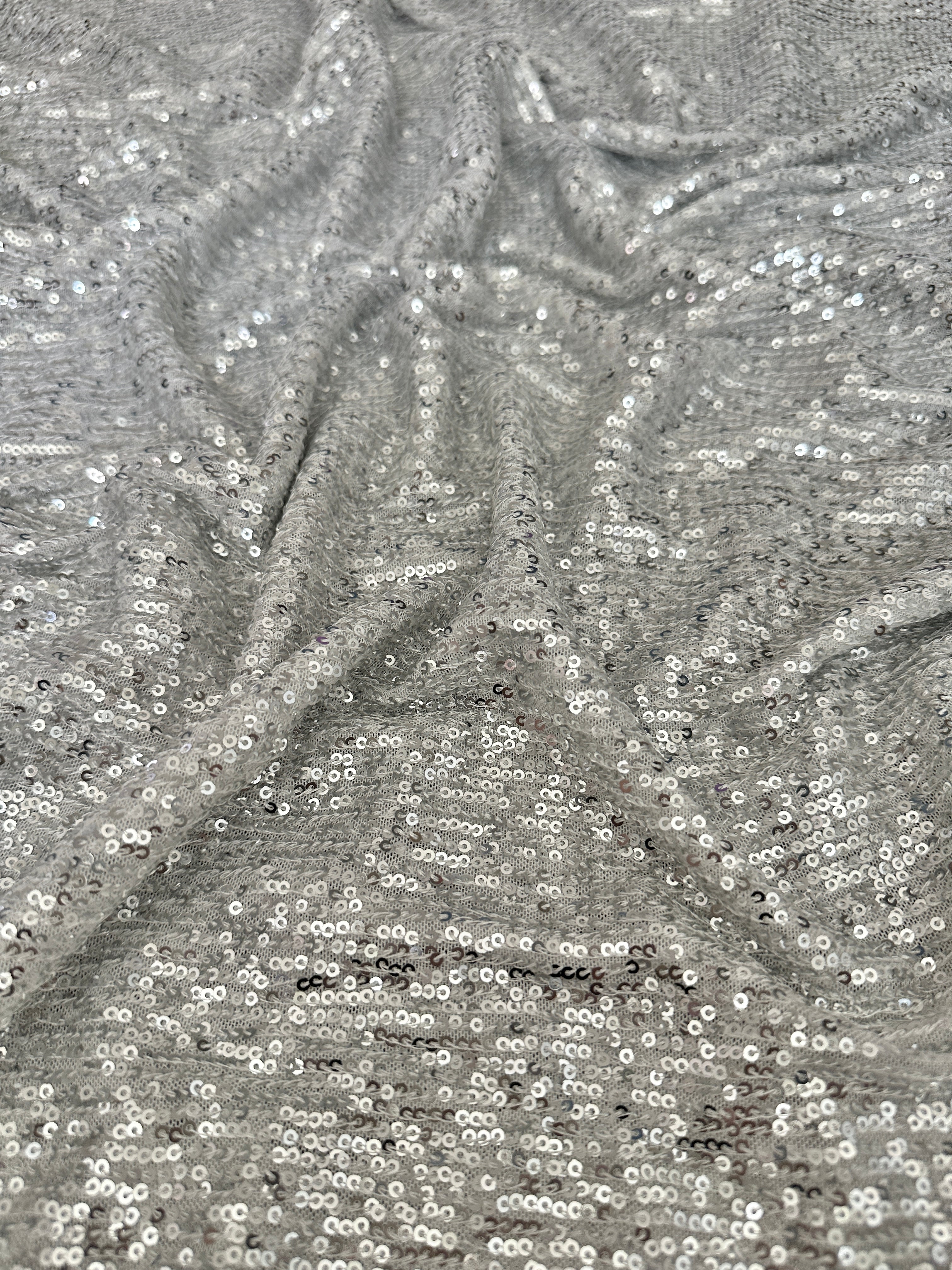 silver super stretch sequin on mesh, light silver sequin on mesh, light silver sequin on mesh, sequin on mesh for woman, sequin on mesh for bride, sequin on mesh on discount, sequin on mesh on sale, premium sequin on mesh, kiki textile sequin on mesh, sequin on mesh for party wear 