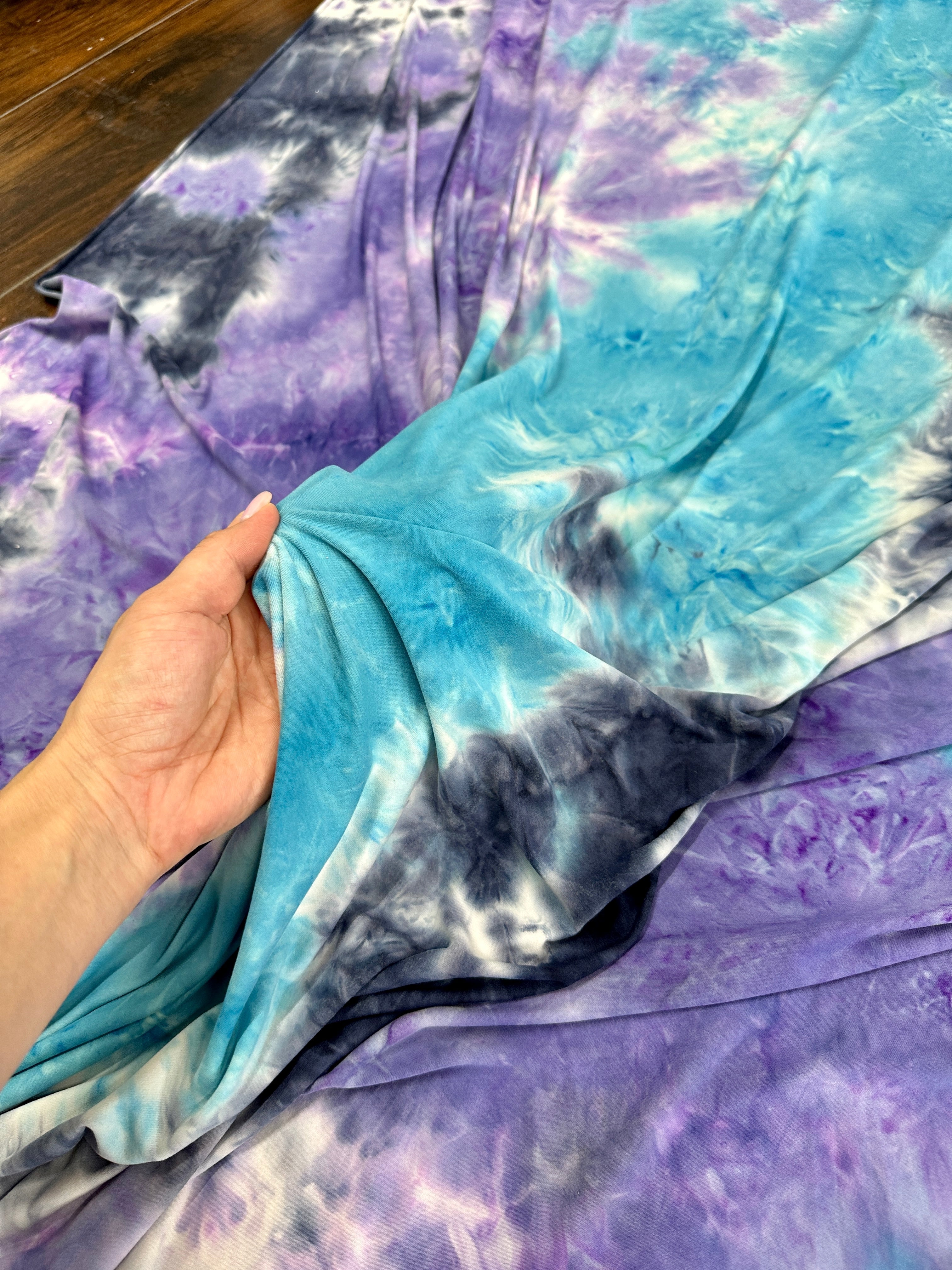 Blue and Purple Tie Dye Jersey Knit, tie dye jersey knit for woman, tie dye jersey knit for party wear, tie dye jersey knit for gown, tie dye jersey knit for bride, tie dye jersey knit on discount, tie dye jersey knit on sale, premium tie dye jersey knit 