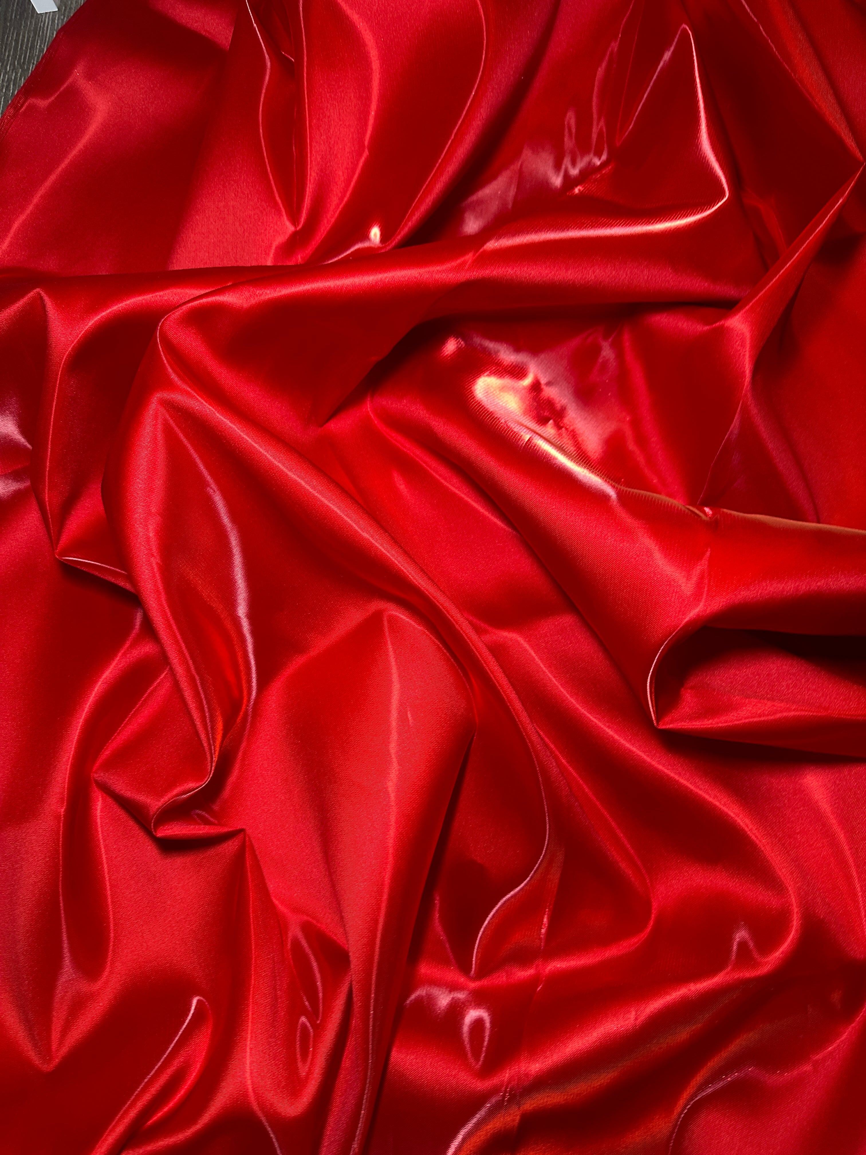 liquid bridal satin in red with folds  close up look 