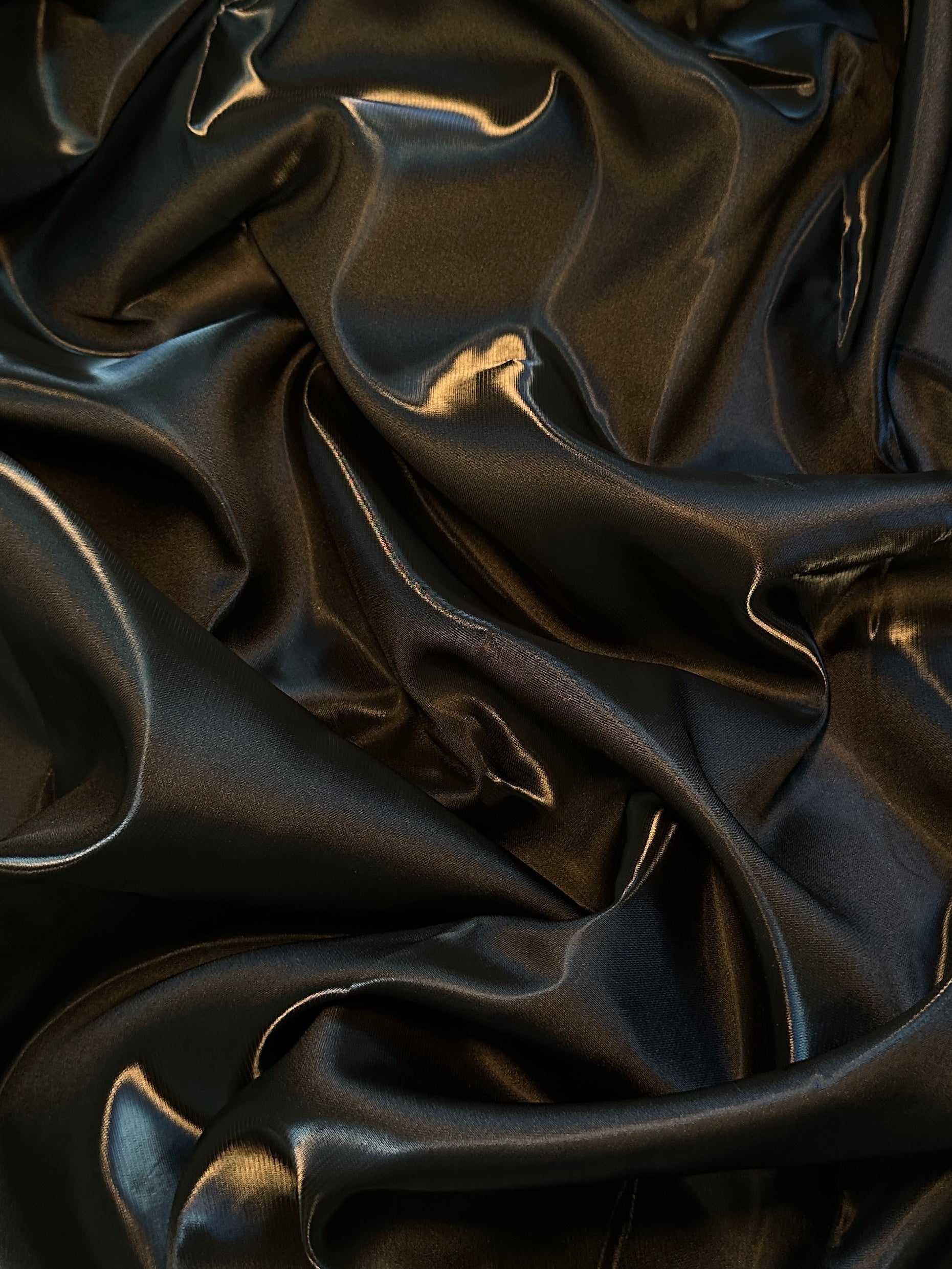 close up look of black liquid bridal satin 