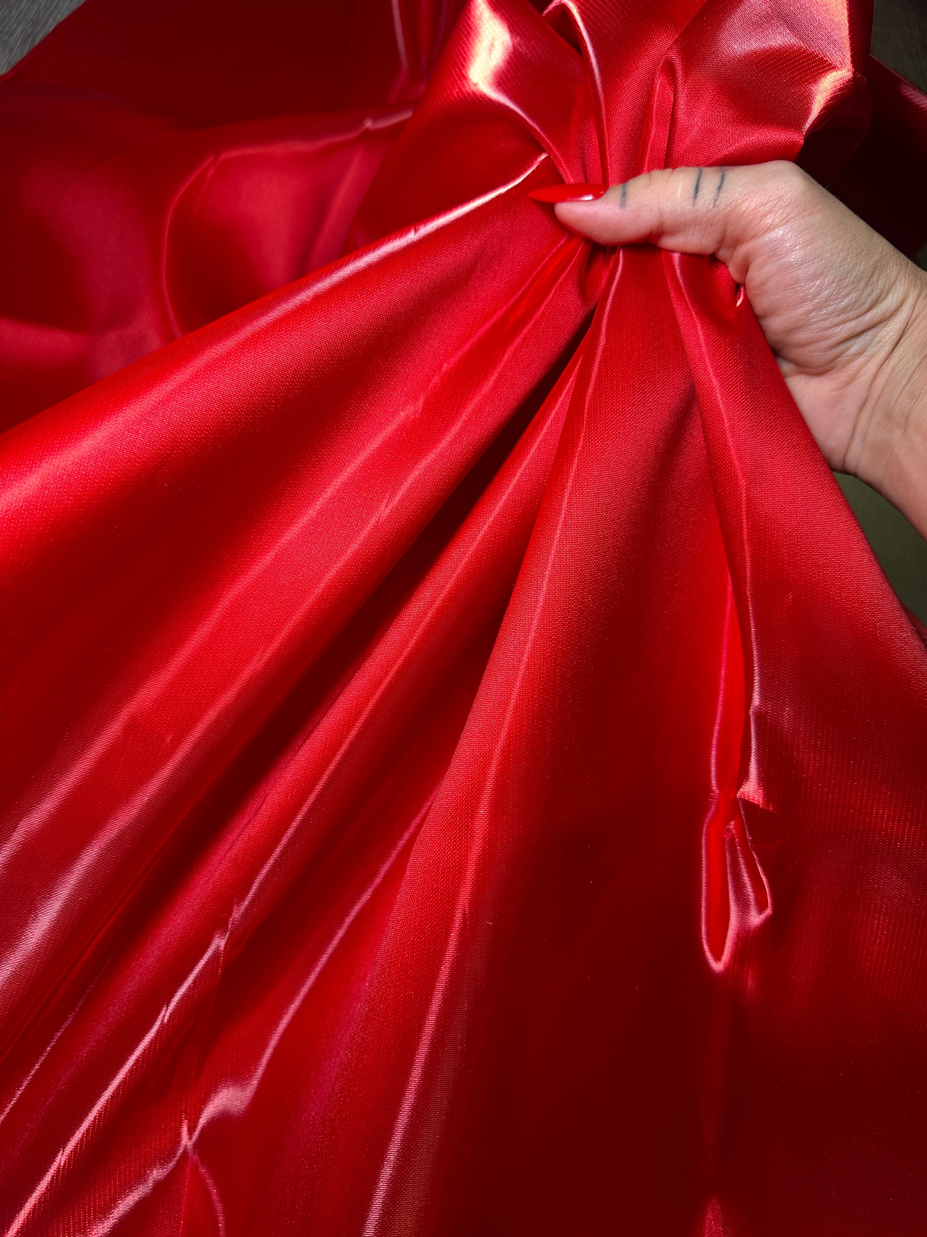 hand showing the red satin closer look 