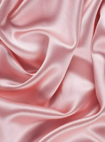 close up look of the swatch of dusty rose fabric by the yard
