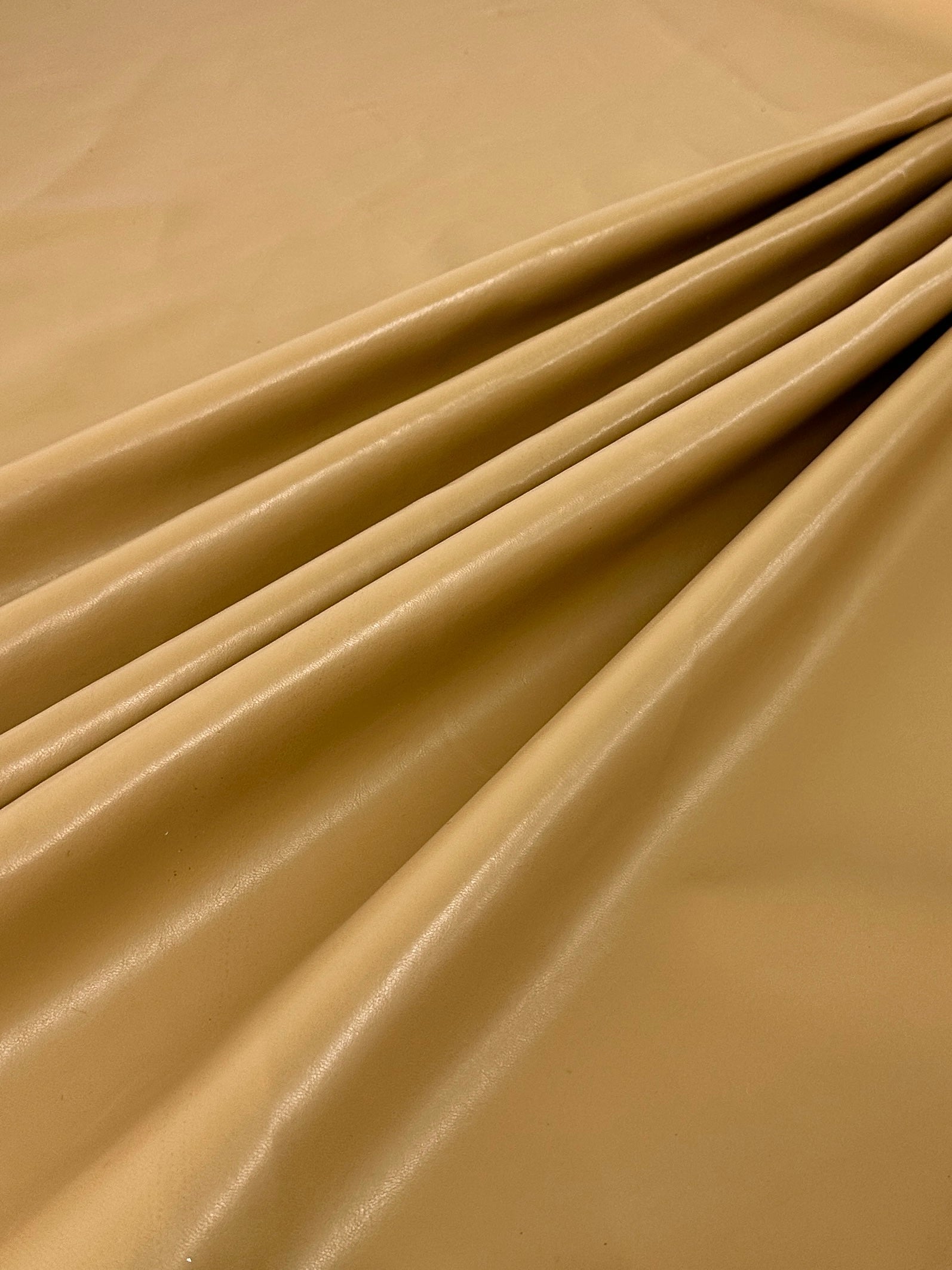 caramel Stretch Faux Leather, light brown stretch faux leather, cream color stretch faux leather, faux leather for woman, faux leather for costumes, faux leather for home decor, 2 way stretch faux leather, leather for blazers, cheap leather, discounted leather, leather on sale