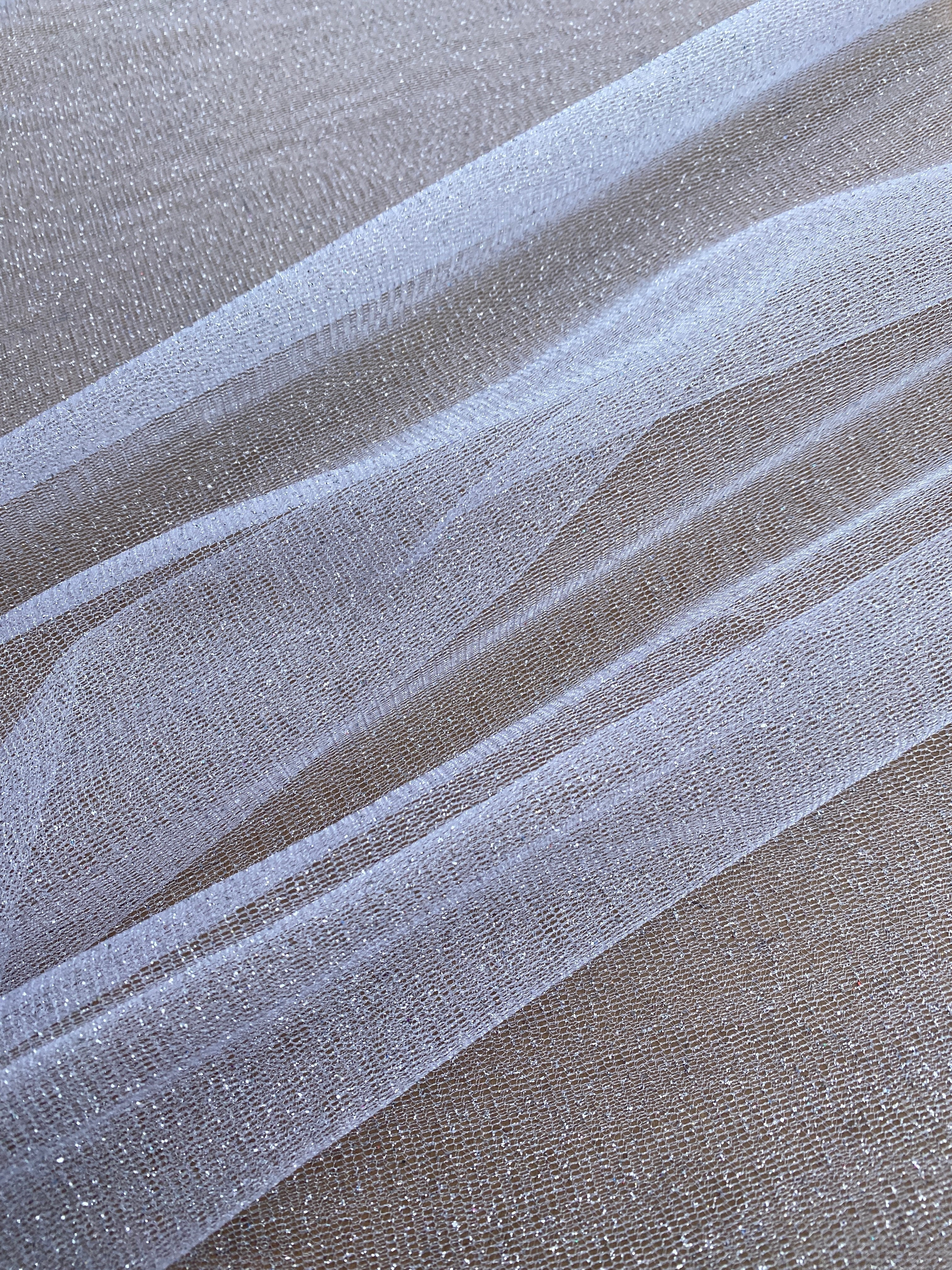 white glitter Tulle, bright white Tulle, off white tulle, milky white Tulle for party wear, white Tulle for dress, Tulle for woman, Tulle for bride, Tulle on discount, Tulle on sale, premium Tulle, buy Tulle online