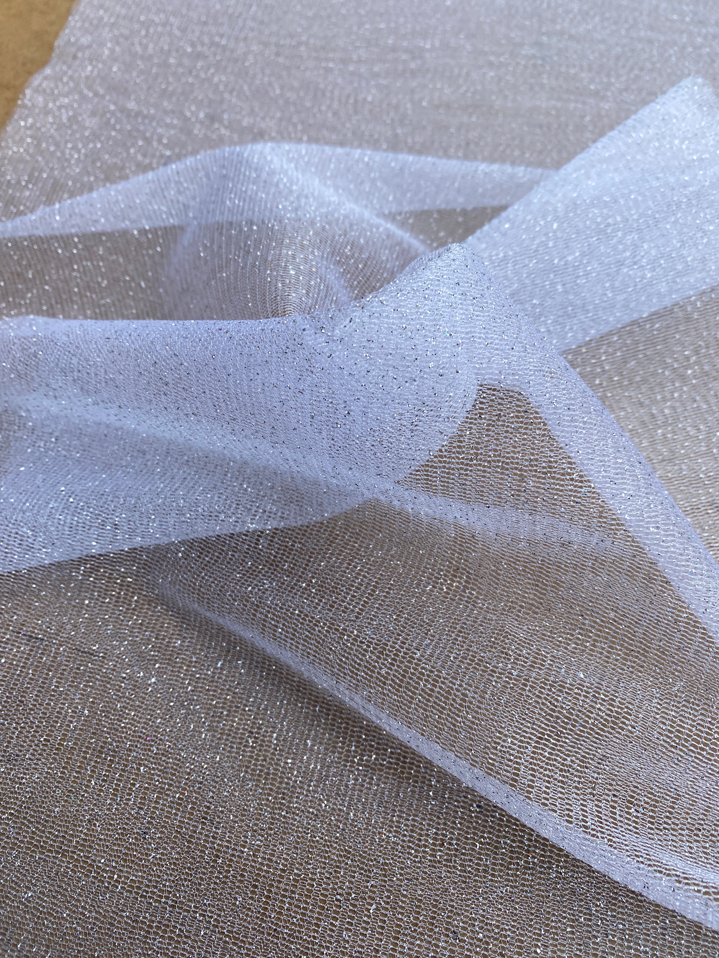 white glitter Tulle, bright white Tulle, off white tulle, milky white Tulle for party wear, white Tulle for dress, Tulle for woman, Tulle for bride, Tulle on discount, Tulle on sale, premium Tulle, buy Tulle online