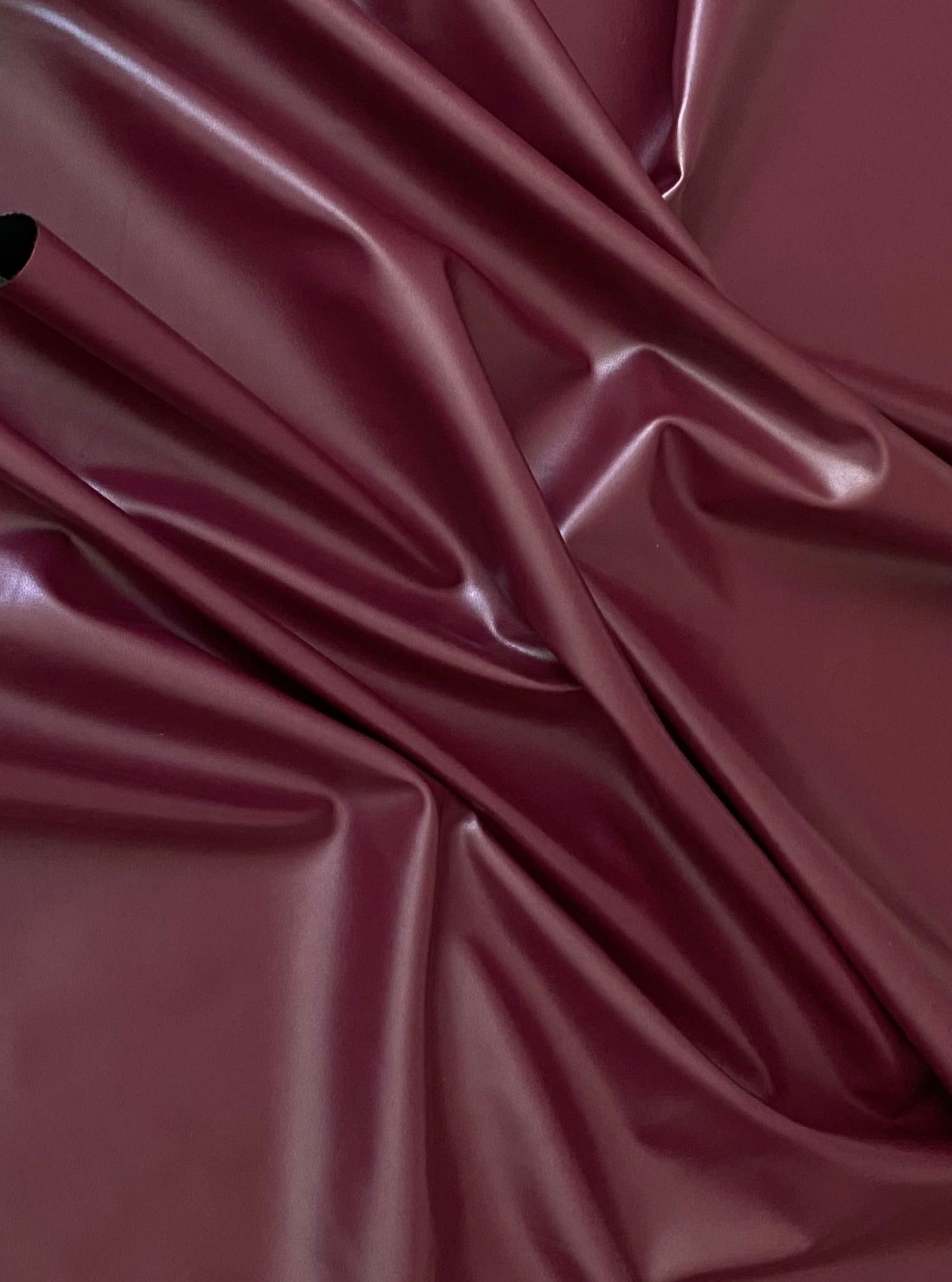 burgundy stretch faux leather, burgundy stretch pleather, burgundy stretch soft vinyl, burgundy stretch vinyl, faux leather stretch for clothing, Faux Leather for jackets, Faux Leather for bags, Faux Leather on discount, Faux Leather on sale, premium Faux Leather, burgundy Faux Leather, maroon Faux Leather, Faux Leather for tops, Faux Leather for leggings