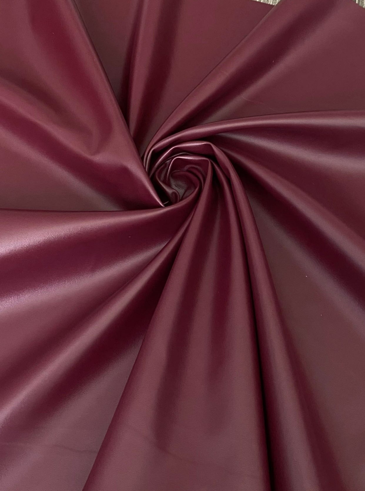 burgundy stretch faux leather, burgundy stretch pleather, burgundy stretch soft vinyl, burgundy stretch vinyl, faux leather stretch for clothing, Faux Leather for jackets, Faux Leather for bags, Faux Leather on discount, Faux Leather on sale, premium Faux Leather, burgundy Faux Leather, maroon Faux Leather, Faux Leather for tops, Faux Leather for leggings