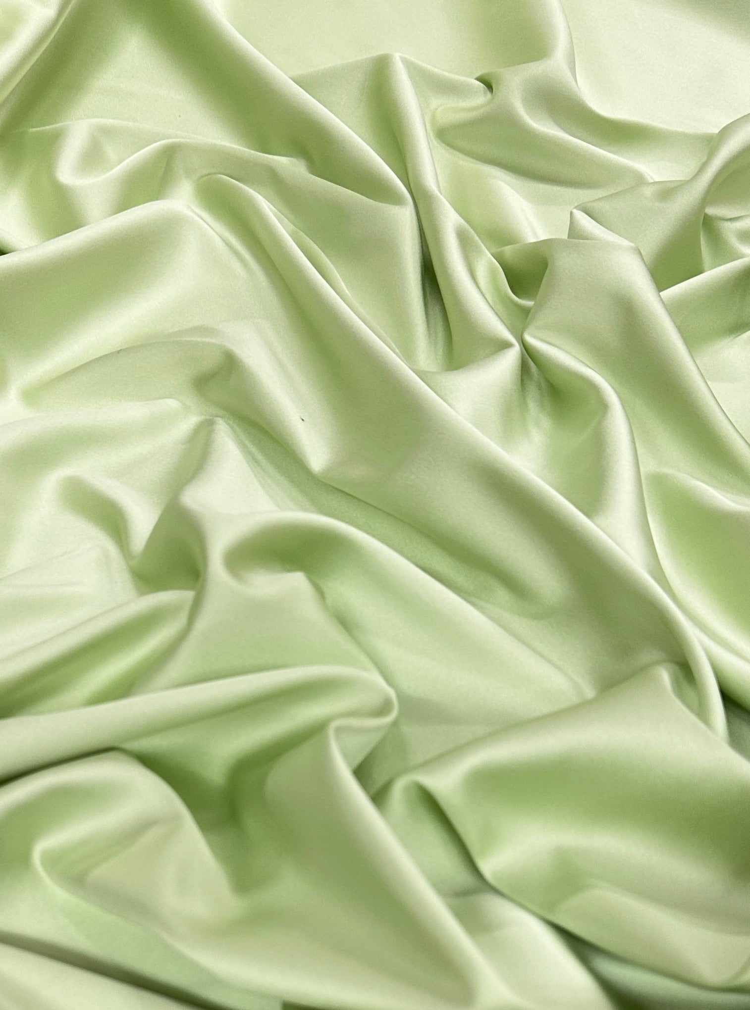 shiny silk fabric, solid silk, solid satin, stretch silk charmeuse, silk fabric by the yard, natural silk, pure silk, 100% pure silk, natural fabric, kiki textiles, online fabric store usa, luxurious fabric, silk satin online, fancy silk, soft silk, smooth silk, 100% natural silk, charmeuse satin, green natural silk, green silk, pistachio natural silk, pistachio silk, green natural stretch silk, pistachio silk, pistachio silk, baby pink silk, green silk satin, pistachio silk satin, light green silk