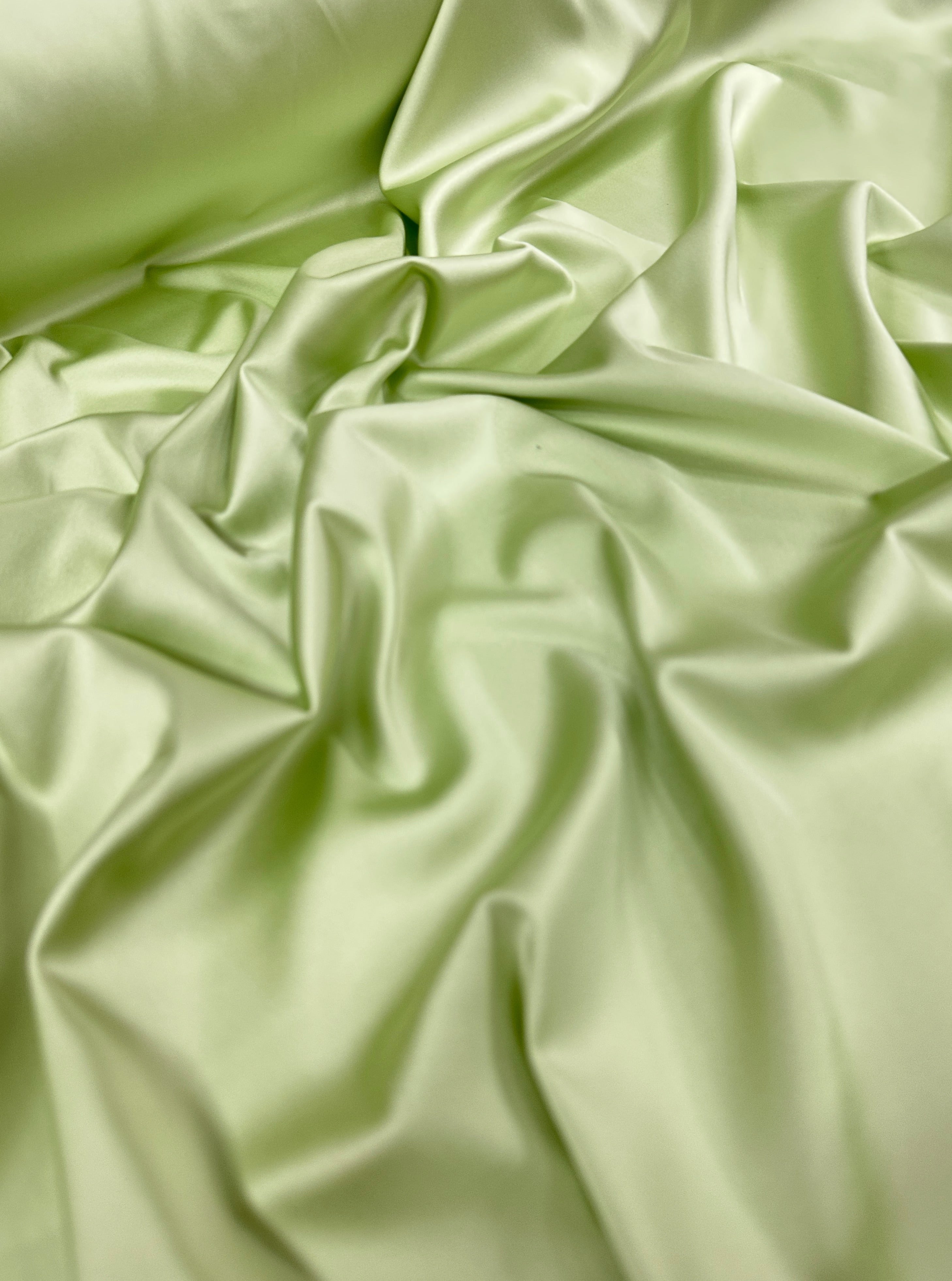 shiny silk fabric, solid silk, solid satin, stretch silk charmeuse, silk fabric by the yard, natural silk, pure silk, 100% pure silk, natural fabric, kiki textiles, online fabric store usa, luxurious fabric, silk satin online, fancy silk, soft silk, smooth silk, 100% natural silk, charmeuse satin, green natural silk, green silk, pistachio natural silk, pistachio silk, green natural stretch silk, pistachio silk, pistachio silk, baby pink silk, green silk satin, pistachio silk satin, light green silk