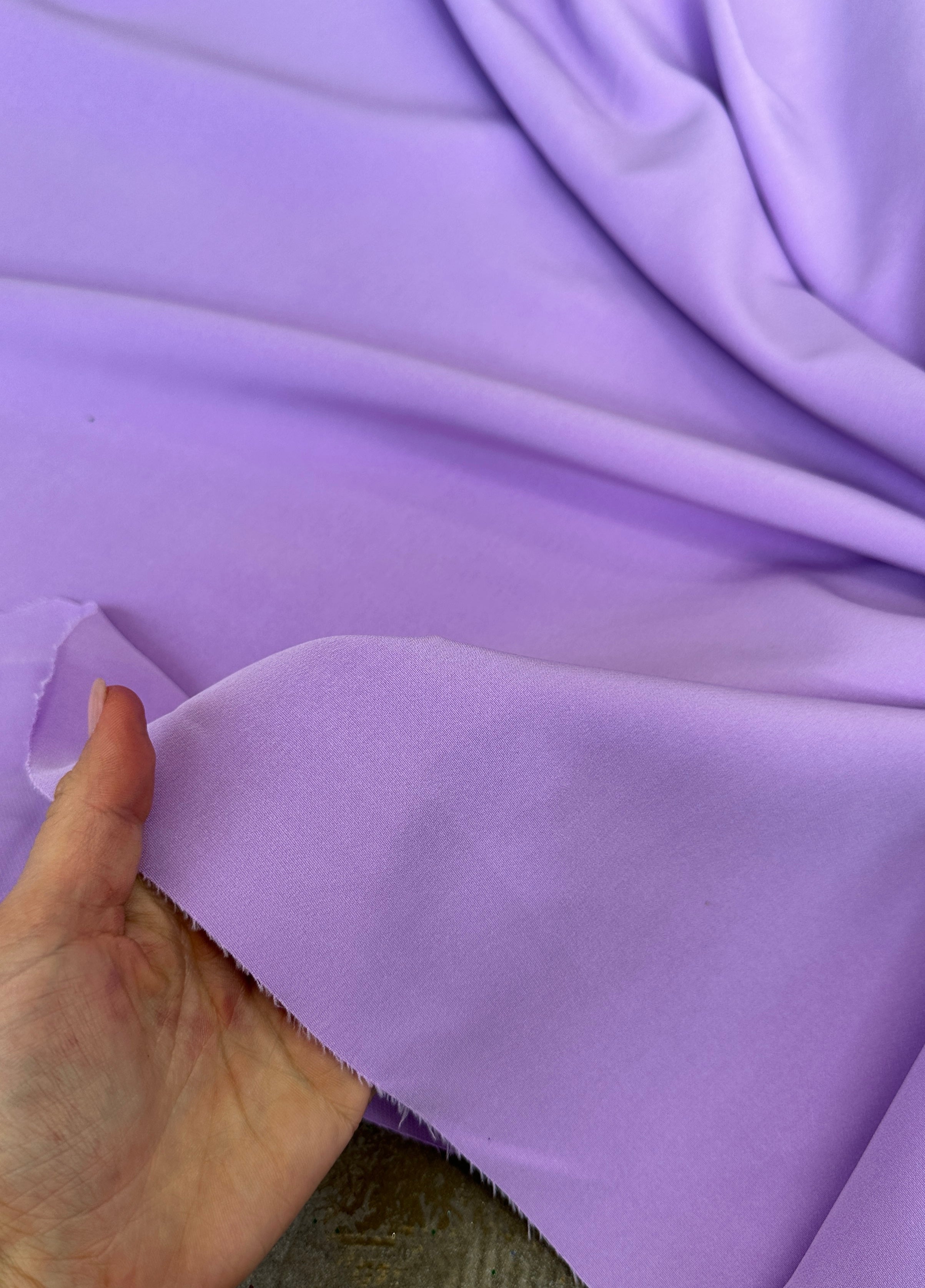 lavender stretch crepe, lavender color fabric, purple color fabric, purple dress for woman, light purple dress, best lavender color, fabric for woman, purple bridal dress, stretch bridal dress, cheap fabric, discounted fabric, buy fabric for woman online, luxury dress for woman, viscose crepe, crepe clothing material, wedding crepe, opac fabric, stretch crepe back satin